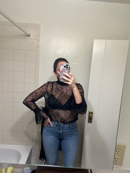 Black lace top, black bralette, date night outfit, flare jeans, light wash flare jeans, light wash jeans, flares, lace top, see through lace top, nyc date night outfit, nyc outfit, nyc bar Outfit, winter date night outfit, what time wear to bars in nyc, black bra, black bralette

#LTKHoliday #LTKSeasonal #LTKfindsunder100