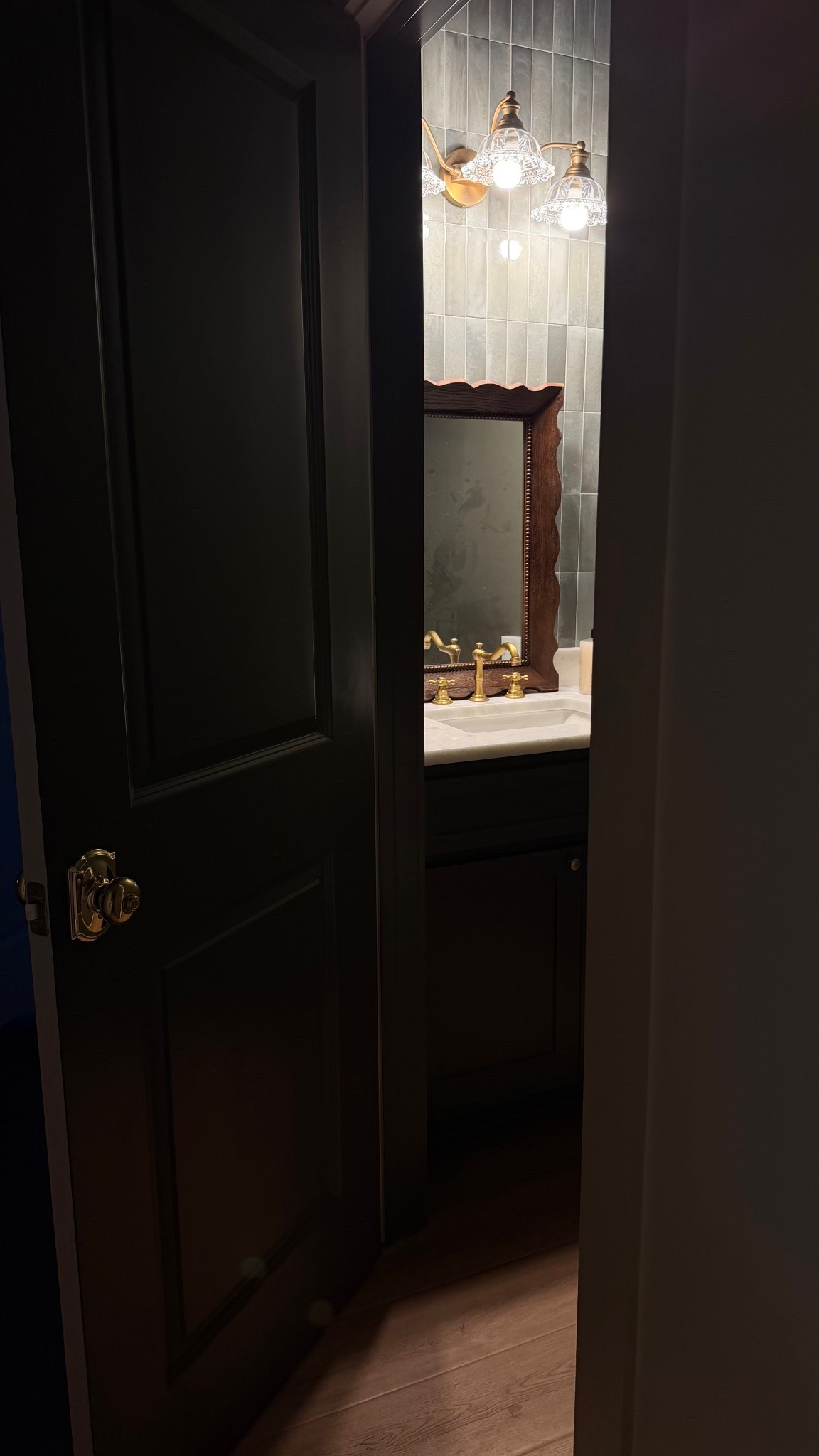 Moody powder room. Probably ought to hang that mirror lol

#LTKHome