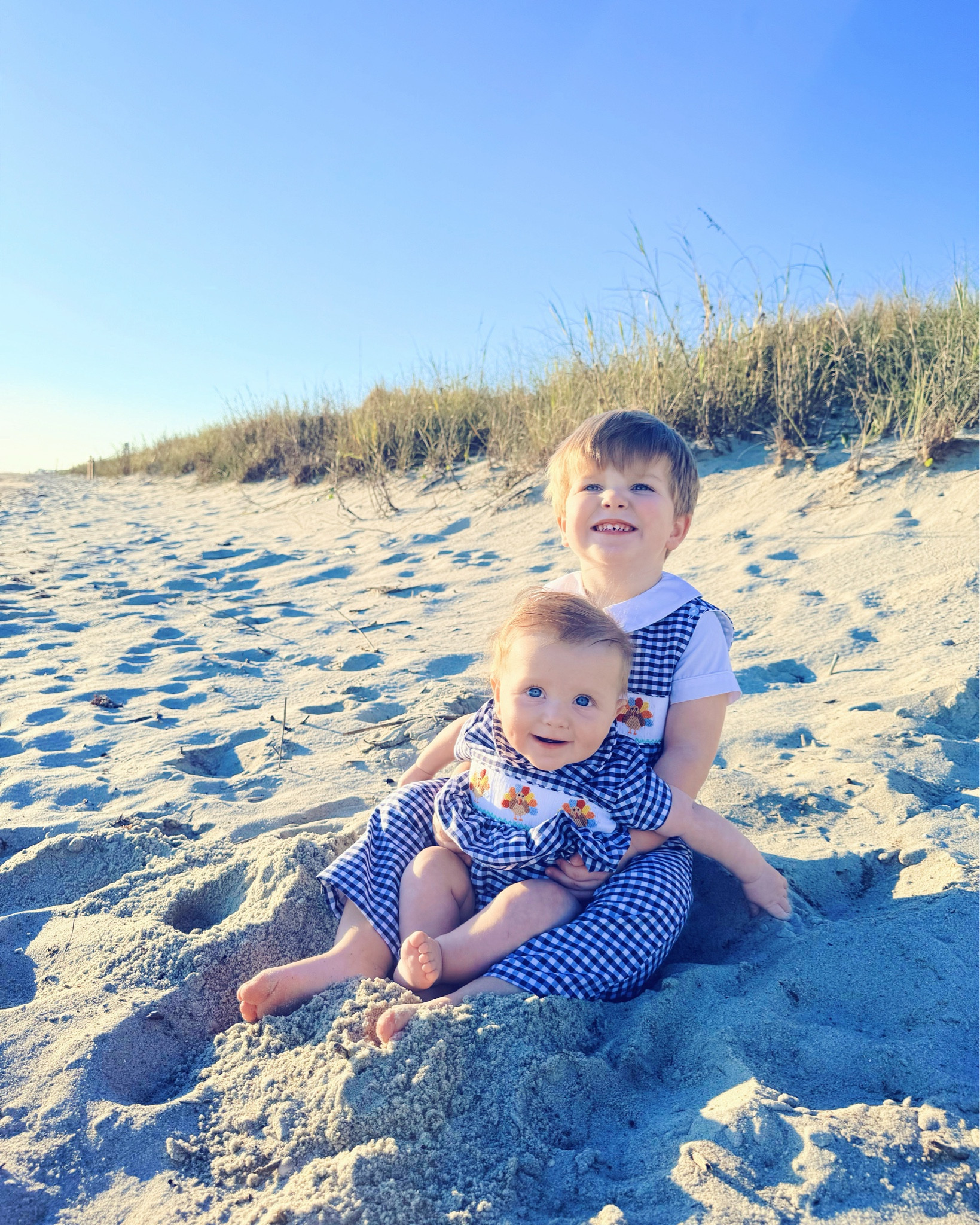 So very thankful for these TWO little cutie pie beach 🌊 baby 👶🏼turkeys 🦃 this Thanksgiving season to love and adore 🥰 - be still my heart!! 😍🤱🩵🌾🏝️🌅 #mylittleturkeys #brotherbesties #beachturkeys #babysfirstthanksgiving #firstthanksgivingasafamilyoffour #boymamax2 #fallbythesea #fallbeachgetaway #seasonofthanks 

I can’t get over the sweetness 🤭 of these brother besties in their matching turkey 🦃 smocks on the beach 🏖️- and yes, I linked 🔗 these absolutely precious @classicwhimsy Thanksgiving 🧡🤎 gingham outfits for y’all over in my LTKit app!! 🫶🏽🏝️🐟🌾⛵️ #beachbabies #matchingbrothers #cutenessoverload 

| Motherhood | Stay at Home Mom | Chasing Dreams | Joyful Motherhood | Faith | Baby’s First Christmas | Newborn and Toddler Days | Boy Mama x 2 | First Christmas as a Family of Four | Fall Getaway | Fall at the Beach | Fall Beach Weekend | Fall by the Sea 

…

#emilysayswes #judsoncarpentermabry #levirhettmabry #mommyblogger #twounderthree #newbornandtoddlerdays #mamaoftwo #fullhandsfullerheart #sahm #joyfulmotherhood #stayathomemom #babysfirstthanksgivingseason #firstchristmasasafamilyoffour #boymamax2 #boymamalife #firstholidayseasonasafamilyoffour #LTKHoliday #LTKfamily #LTKBaby @shop.ltk 

#LTKTravel #LTKSeasonal #LTKBaby