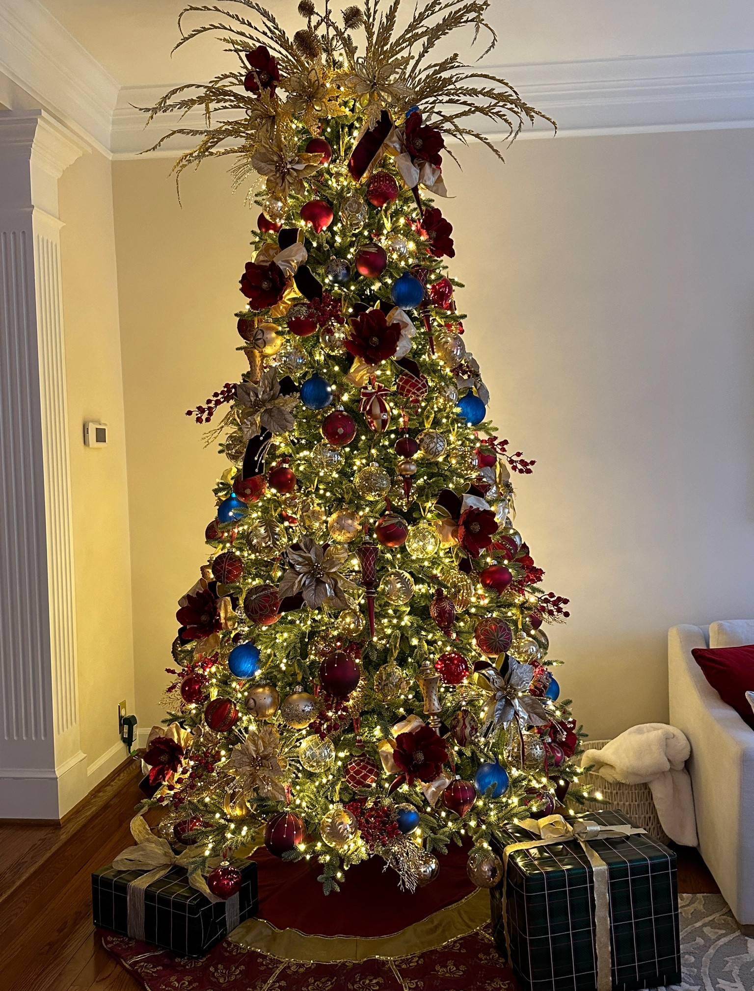 Burgundy and gold this year for my living room tree with pops of blue

#LTKhome #LTKSeasonal #LTKHoliday