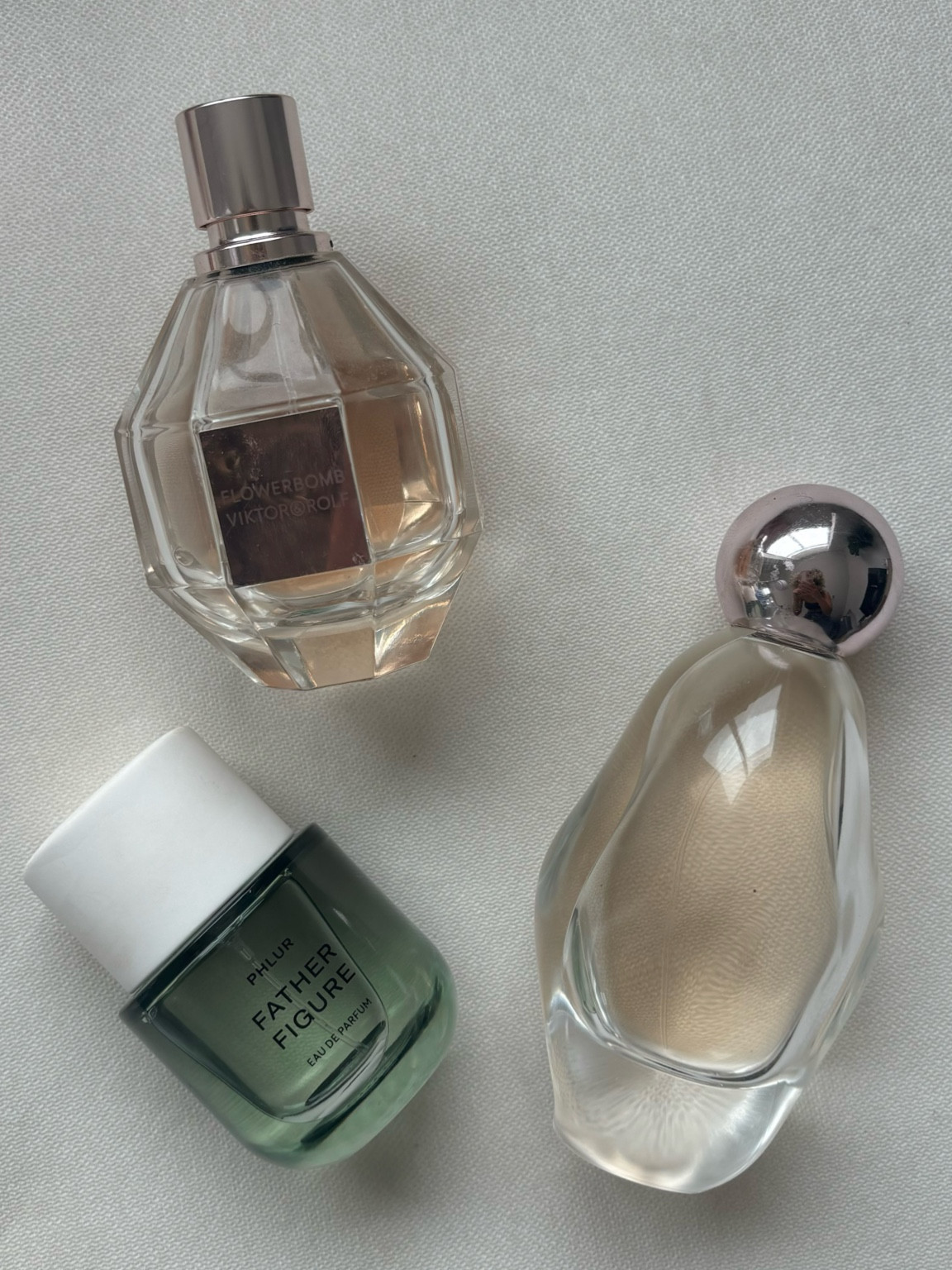 my favorite perfumes based off my mood✨ I wear father figure when I want a more masculine and sexy scent, and flowerbomb or cosmic for a more feminine and sweet scent