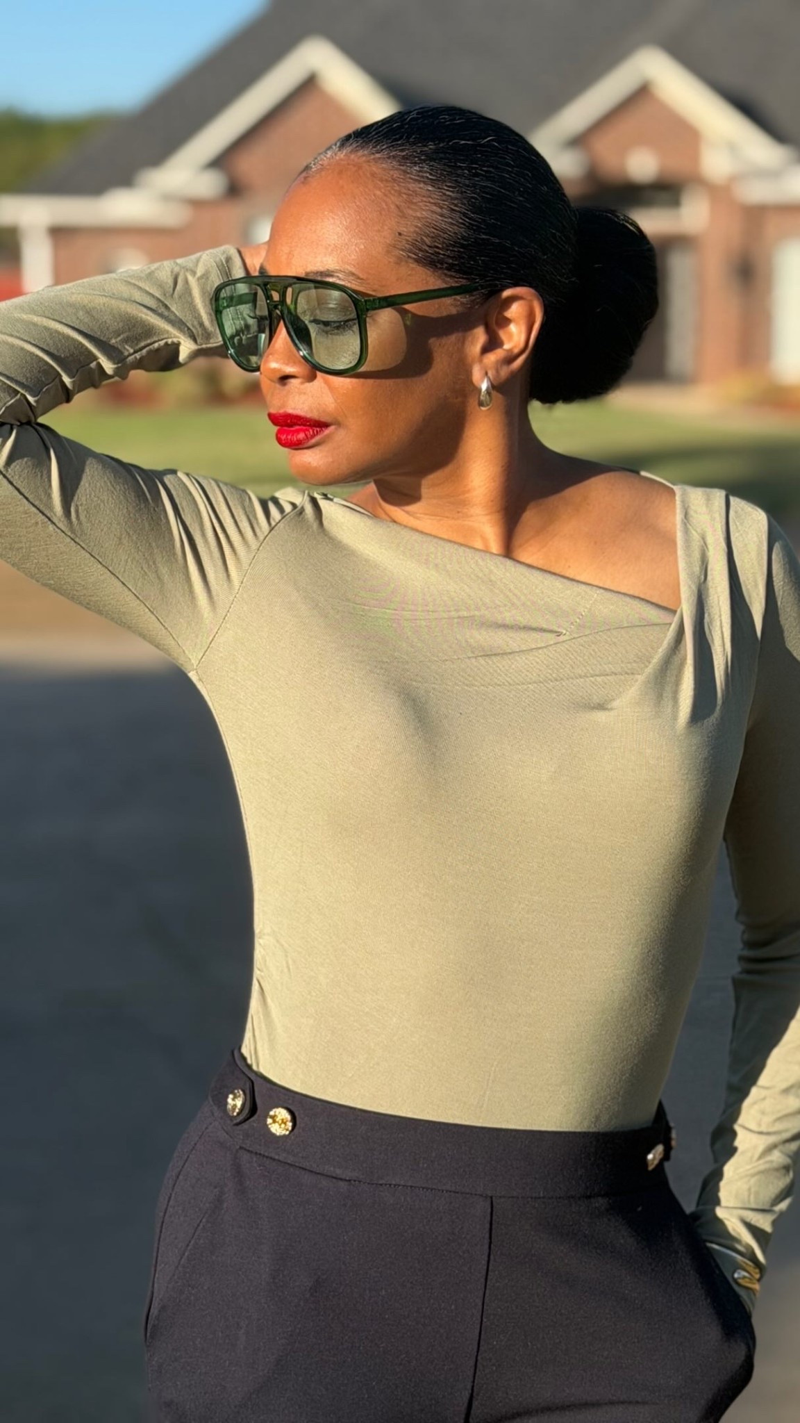 Ladies, I’m being polished on purpose!!! Monday doesn’t get my leftovers. It gets the drape, the gold buttons, and the red lip.

Olive and navy are officially part of my fall color story. The draped neckline brings the femininity, the tailored trousers bring the polish, and the pointed pumps finish it off.

Sleek bun. Green aviators. Golden-hour light.

I’m not dressing to blend in. I’m dressing like I mean it.

What’s your Monday outfit formula? 🤍

Follow along for style, beauty & refinement over 40.

She didn’t find herself. She refined her.

xoxo, Mystiqua Trinette

#styleover40 #fashionover40 #ootd #fashionover50 #over50style
