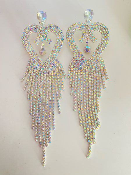 I love these Rhinestone Heart Design Drop Earrings from SHEIN. They are super sparkly, iridescent and a perfect accessory to add to a fancy outfit. depending on the lighting, the rhinestones are a different color such as pink, purple blue and more. These earrings are so stunning. 

#LTKbeauty #LTKstyletip #LTKtravel
