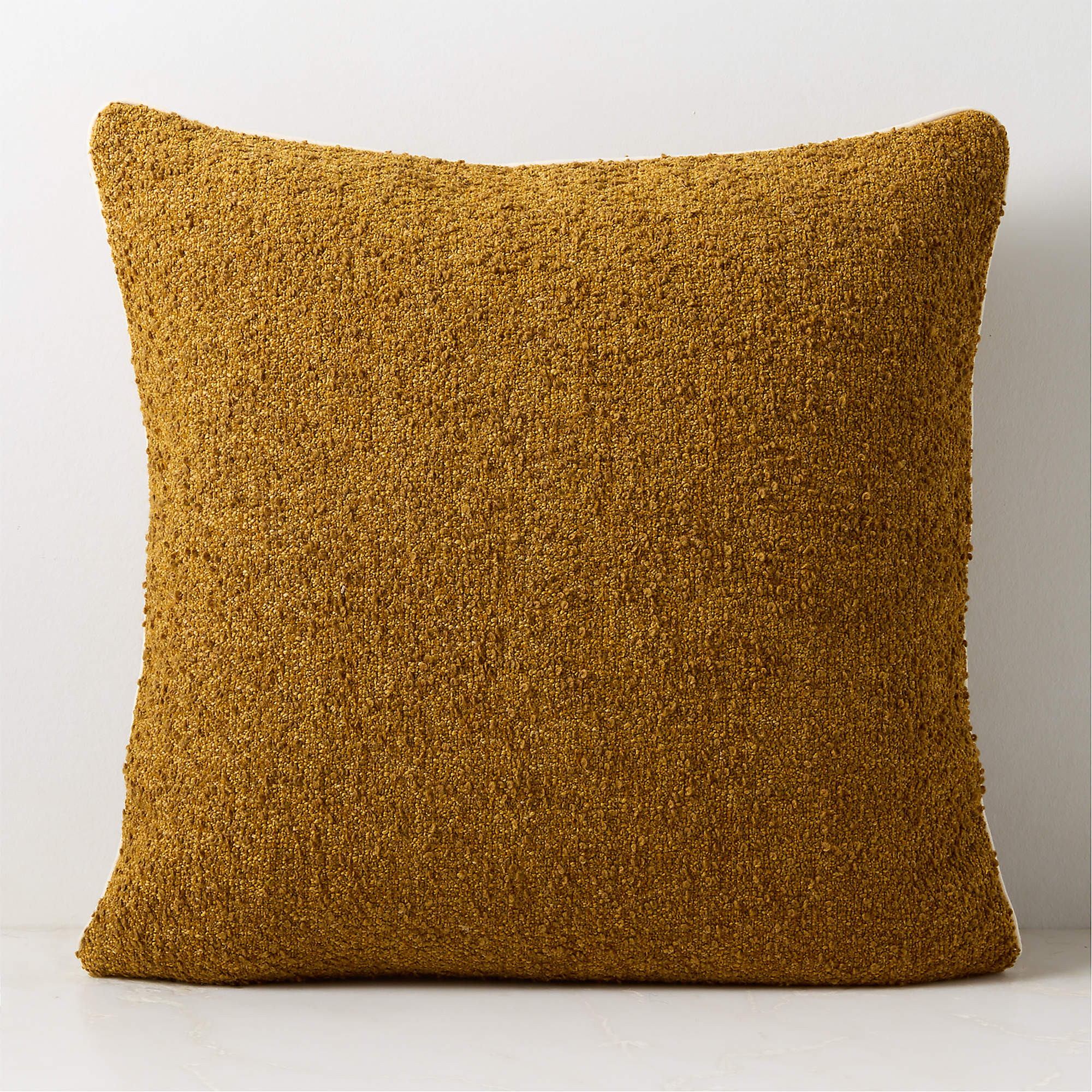 Strada Dull Gold Boucle Italian Wool Throw Pillow with Down Alternative Insert 23"x23" + Reviews ... | CB2