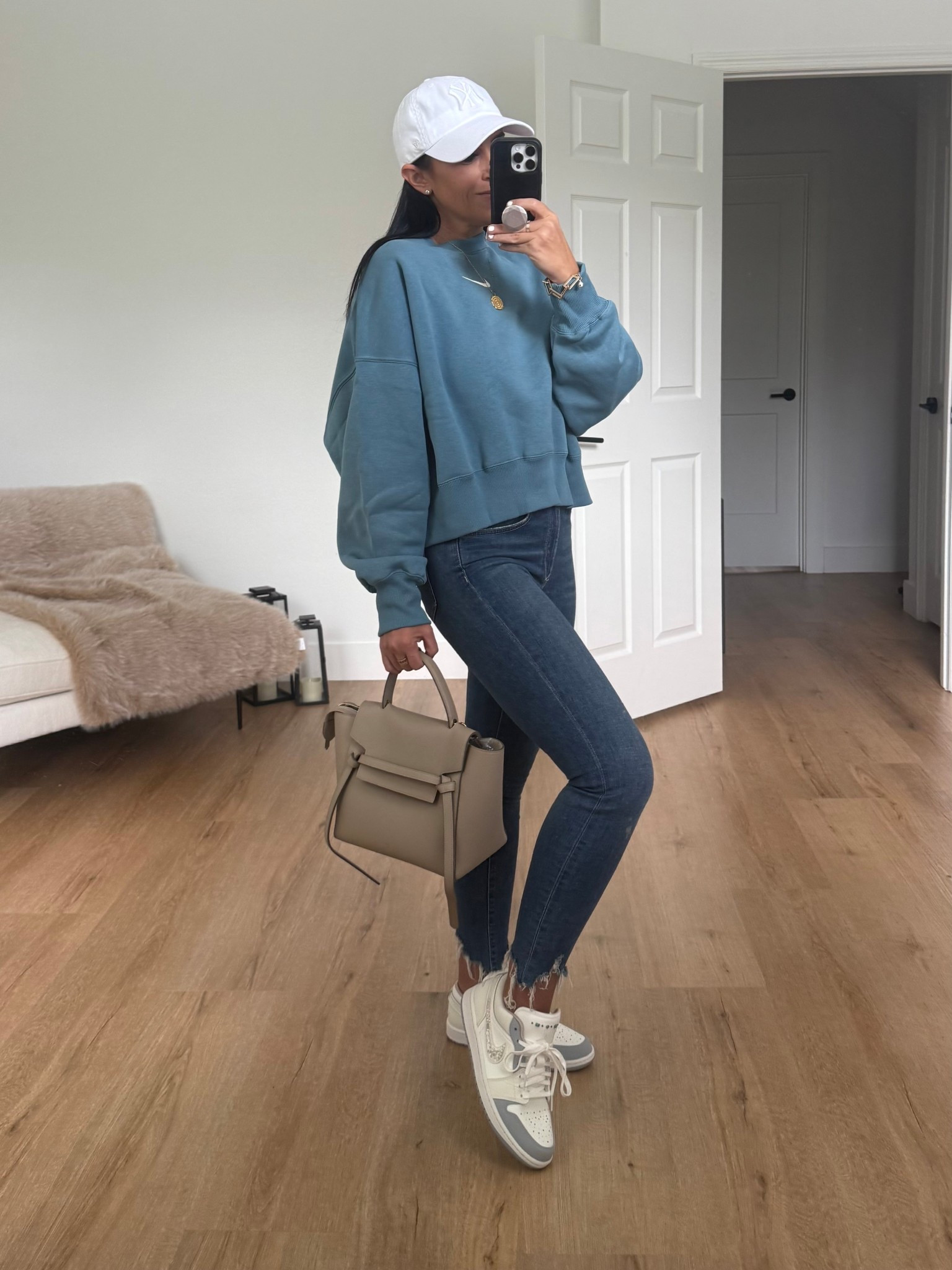 Nike Sportswear Phoenix Fleece
Women's Over-Oversized Crew-Neck Sweatshirt wearing small. Sofia Vergara jeans. Nike Jordans