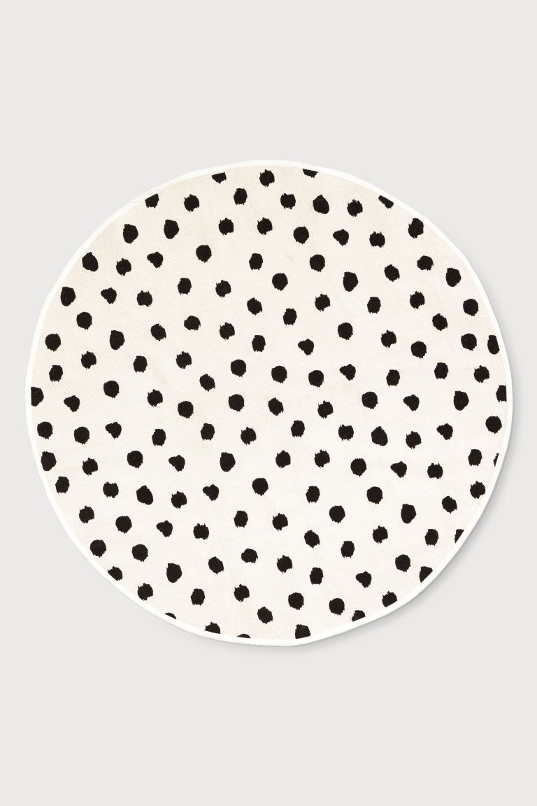 Round rug in woven cotton fabric with a printed pattern at front. Non-slip protection at back. | H&M (US + CA)