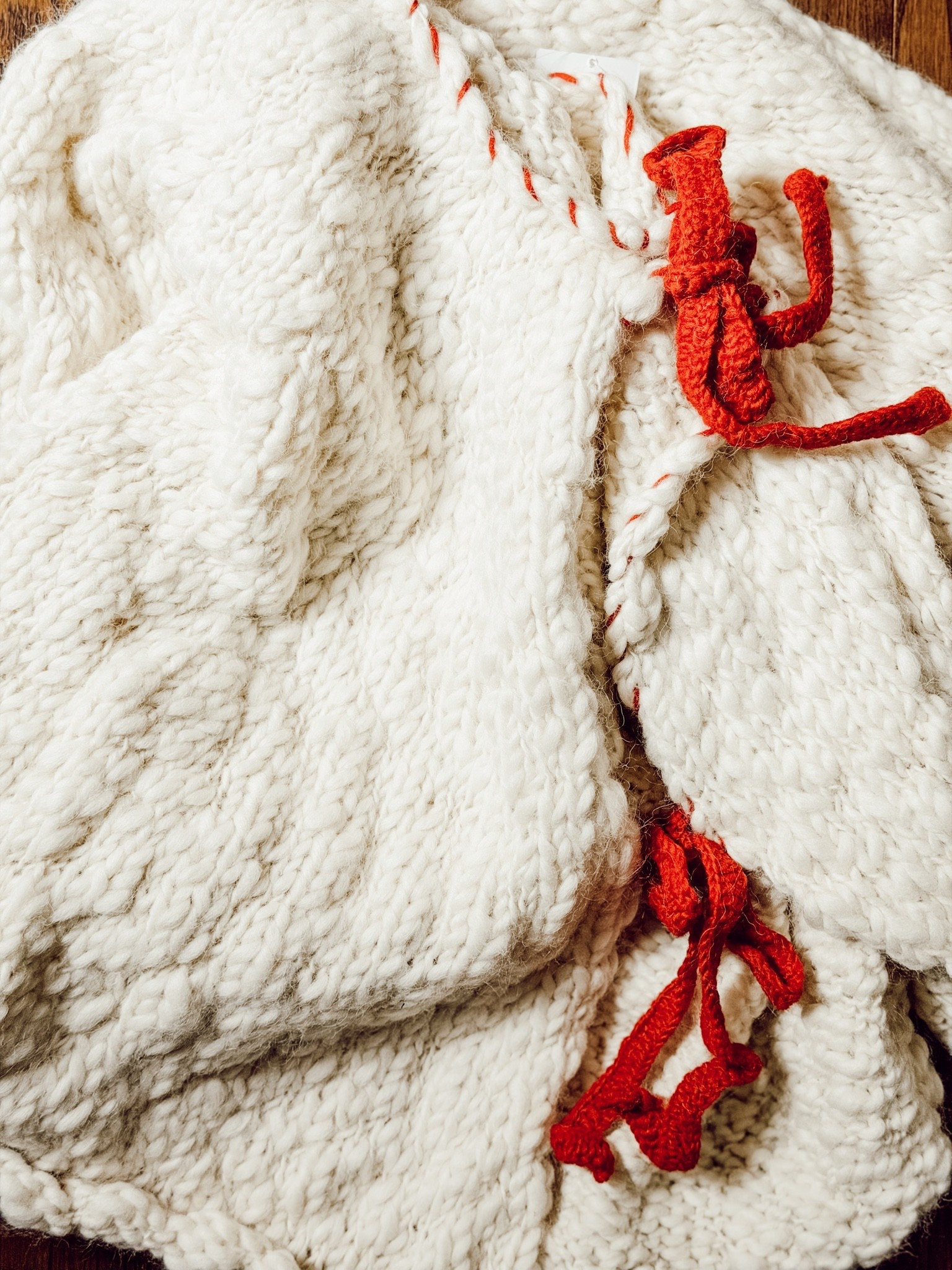 Love the cozy texture and red ties on this tree skirt. #anthropologie

#LTKHome #LTKSeasonal