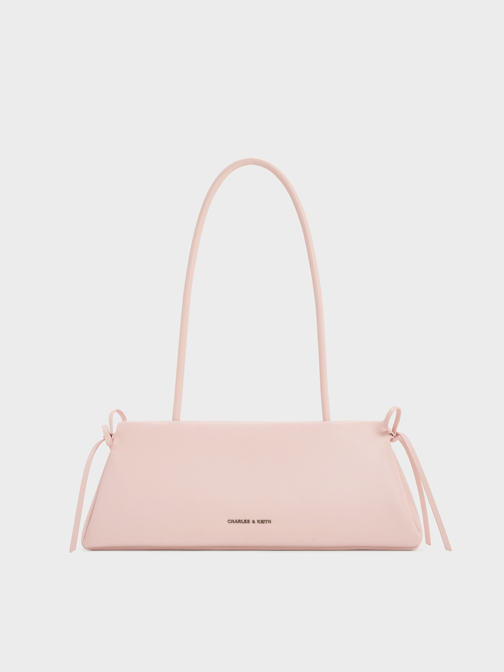 Hazel Bow Elongated Trapeze Shoulder Bag
    
         - Soft Pink | Charles & Keith UK