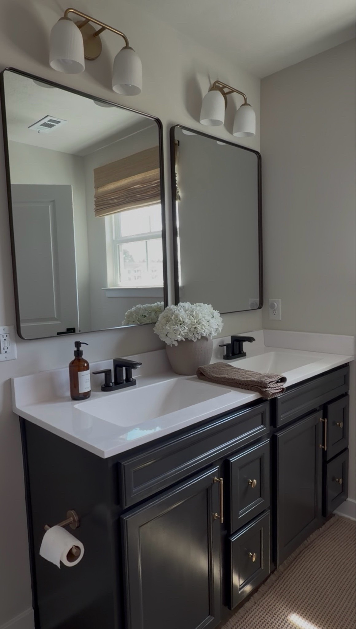 Bathroom, champagne bronze, delta, bronze mirror, bronze mirrors, brass lights, brass hardware, brown hand towel, brown bath towel, tan runner, waffle runner, brown soap bottle, tan vase, magnolia vase, champagne bronze knobs, champagne bronze handles

#LTKSaleAlert #LTKHome #LTKU