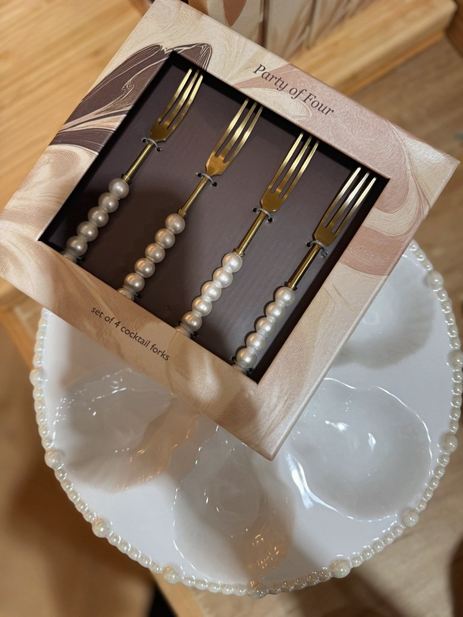 I was in Anthropologie and saw this oyster serving platter w pearl detailed cocktail forks. I know it’s a very specific thing but for a brunch, lunch, dinner, NYE or hosting a cocktail party it’s a pretty presentation for serving oysters.

The plate is 100% handpainted and glazed stoneware that’s dishwasher and microwave safe.

#LTKSaleAlert #LTKHome #LTKHoliday