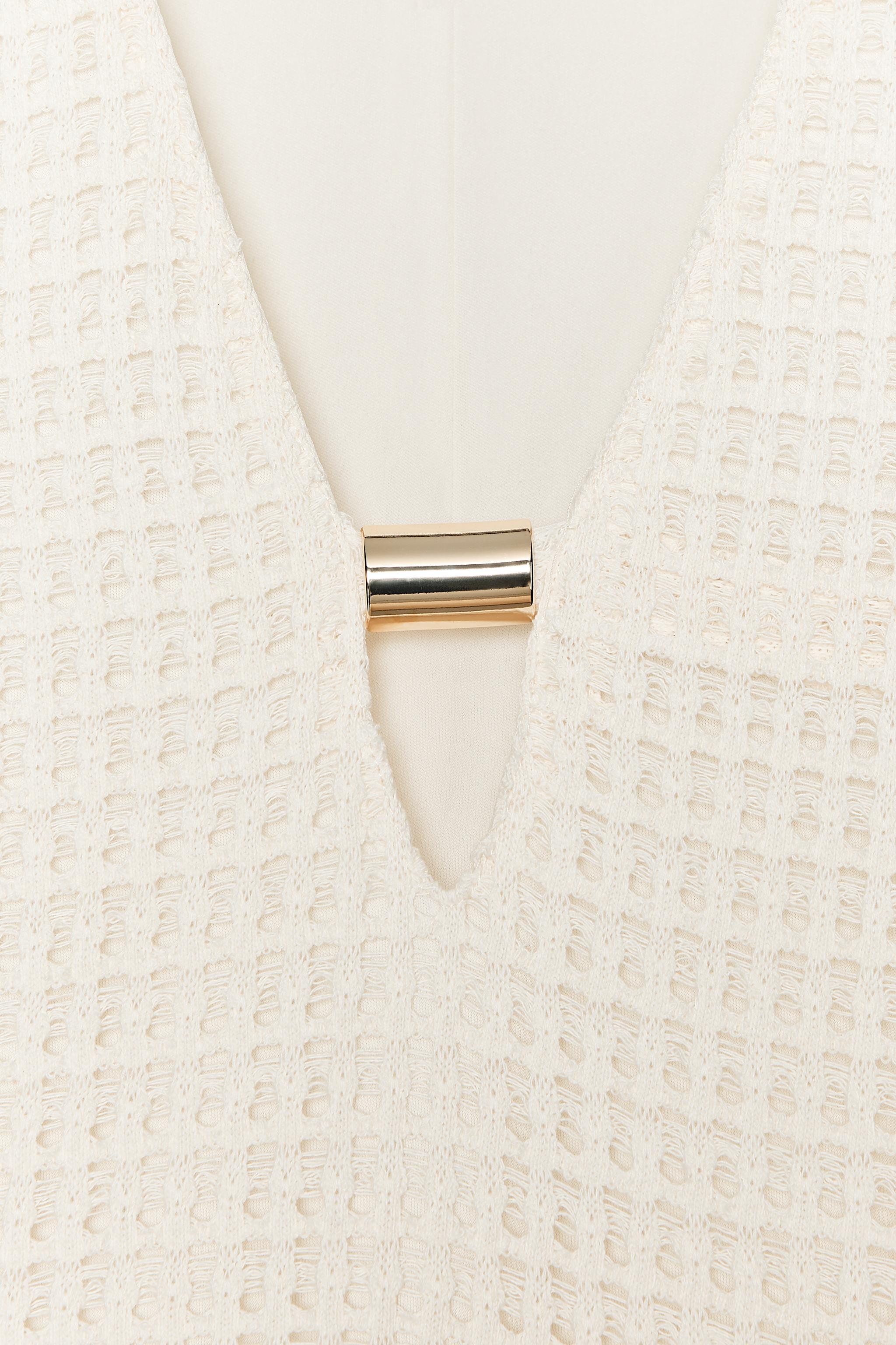 V-neck dress with gold appliqué and long sleeves. Lined. | Zara UK