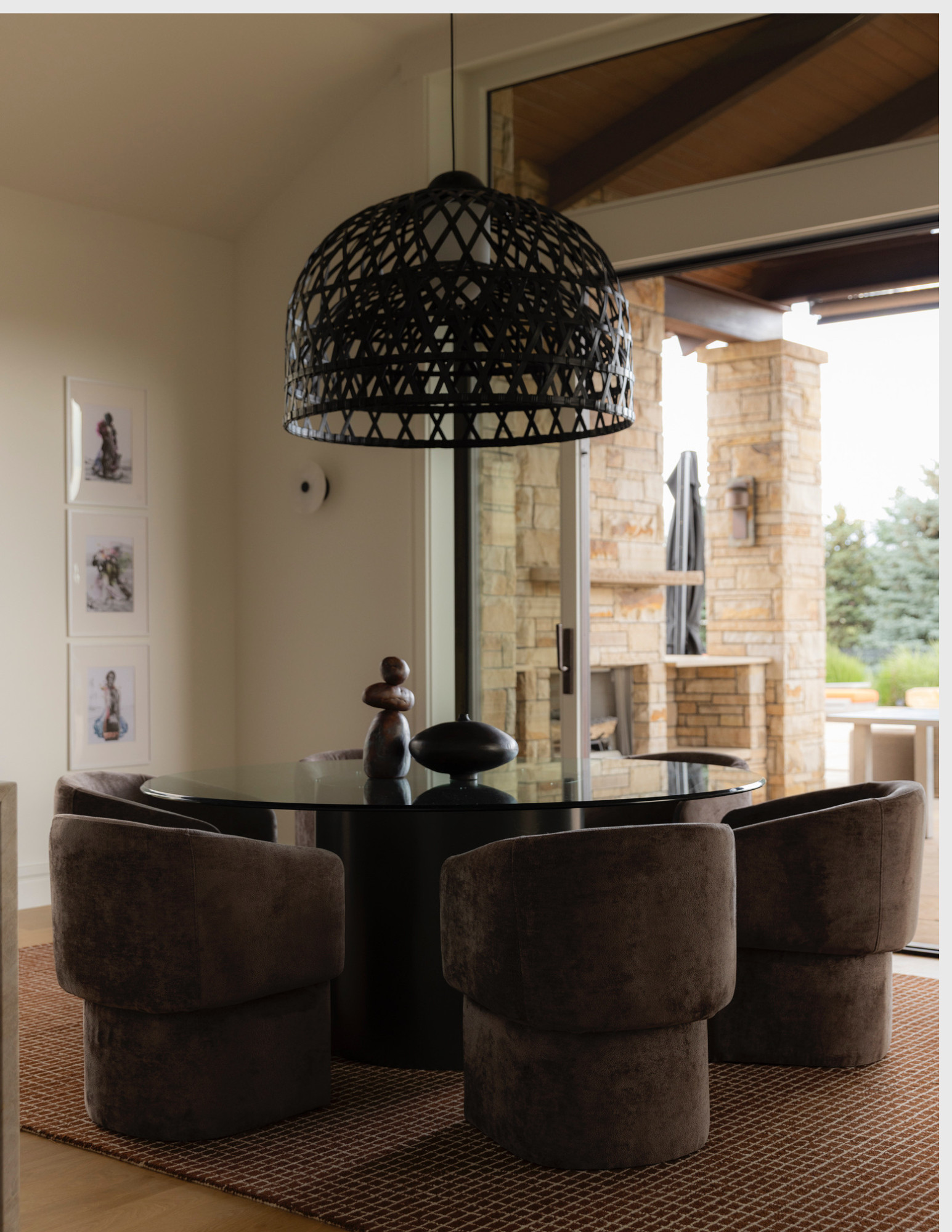 This space creates a warm, modern elegance with its earthy color palette and sophisticated textures. The plush, velvet-like chairs offer a cozy contrast to the sleek, round glass table.  

 #LTKHome #LTKStyleTip