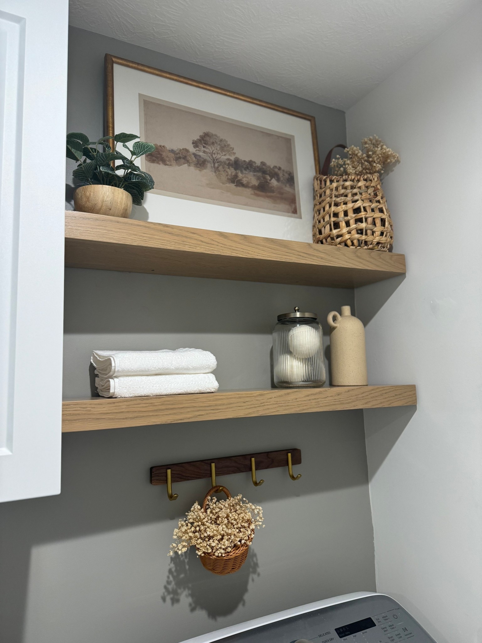 Laundry room details! 

The cabinet was from Lowe’s or Home Depot along with the hardware! I can’t remember the exact ones! The art is sold out so I’m tagging one that is very similar! 