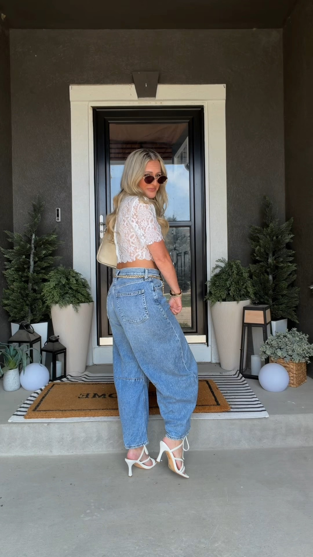 Date night outfit with barrel jeans, a white lace crop top, and strappy heels. I love pairing dressier pieces with denim because it feels polished without being too formal. It’s the kind of outfit that’s effortless, feminine, and perfect for dinner, drinks, or a night out.

#LTKootd #LTKmomlife #LTKOver40