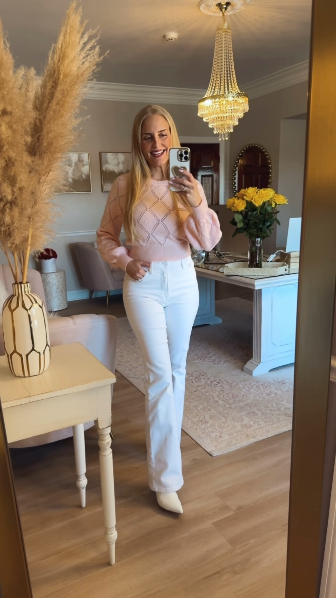 A cute pink sweater and white flare jeans, plus the neat white ankle boots.  

#LTKSeasonal #LTKStyleTip #LTKOver40