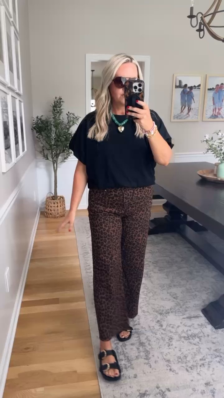 These leopard pants are such a fun way to add a little personality to an everyday outfit. Paired with a simple black tee and bold accessories, this look feels trendy, effortless, and perfect for casual summer days or travel outfits.

leopard print pants, casual chic outfit, graphic tee style, trendy summer outfit, everyday fashion, statement pants, boutique style, effortless outfit idea, neutral fashion, lovelylifestyling

#LTKootd #LTKSeasonal #LTKOver40