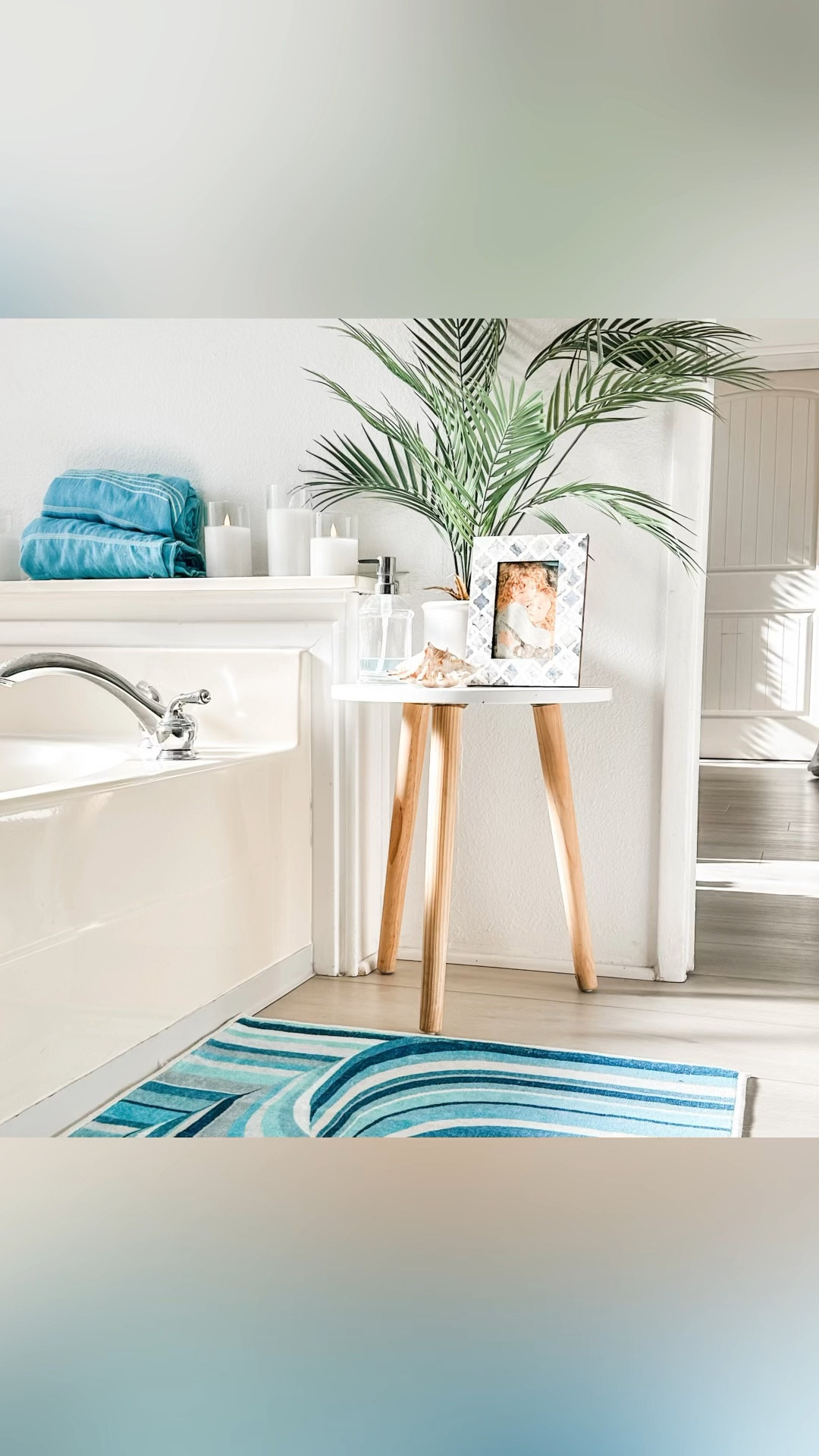 Transform your dated bathroom into a coastal oasis without breaking the bank! 

Our budget-friendly remodel features homedepot charming coastal wood vanities and Lifeproof flooring – waterproof and kid-proof WOO HOO! I elevated the space with ruggable washable rugs in a playful Jonathon Adler print. I found beachy accessories galore at Homegoods, embracing the joy of treasure hunting I love so much. Amazon had the best deal on turkish towels and kid safe battery operated candles. The striking Great Big Canvas print adds plenty beach vibes to complete the look. #ltkdiy #ltkdecor

#LTKfindsunder50 #LTKVideo #LTKhome