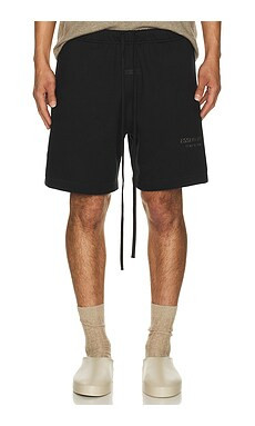 Fear of God ESSENTIALS Soccer Fleece Shorts in Jet Black from Revolve.com | Revolve Clothing (Global)