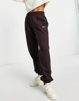 Nike Collection Fleece loose-fit cuffed sweatpants in dark brown | ASOS (Global)