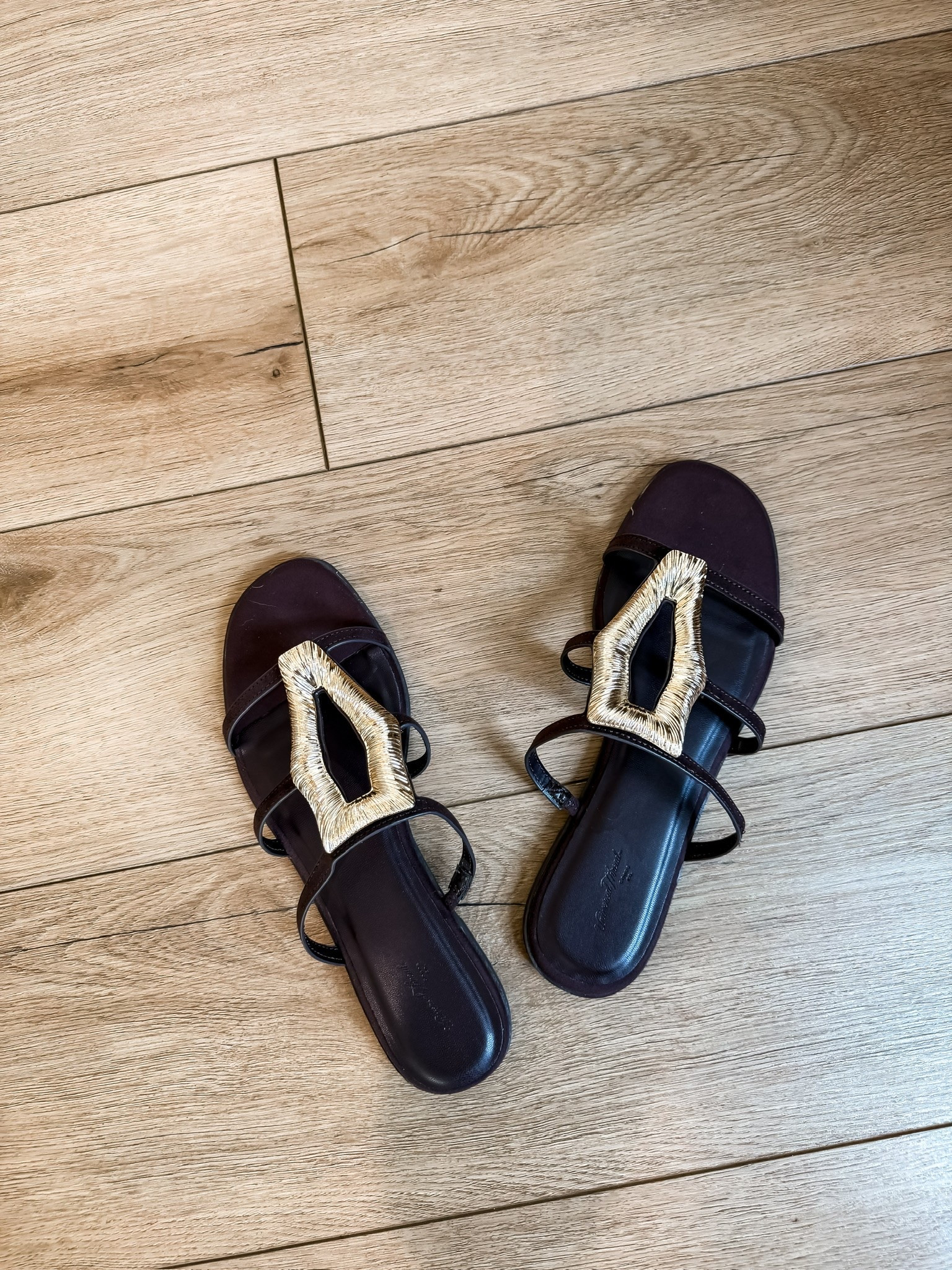 These sandals are the kind of find that instantly makes an outfit feel more elevated 🤎 The statement gold detail gives designer energy while still being easy enough for everyday wear. Such a good neutral pair to style with dresses, denim, and vacation looks.

statement sandals, neutral sandals, summer shoe finds, designer inspired style, vacation sandals, chic everyday outfit, elevated accessories, casual summer style, trending sandals, warm weather fashion, outfit staple, themominstyle

#LTKootd #LTKTravel #LTKSeasonal