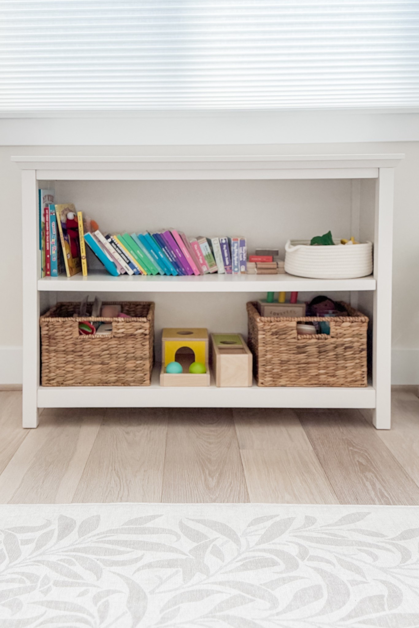Chloe has finally accumulated enough of her own “baby toys” to warrant having baskets in her room to help wrangle them. 

Our playroom has plenty of toys for various ages / development groups, but the ones that live in Chloe’s room (along with her books) are *just for her*.

Sometimes we need to retreat into her room to get some space for her to just be a baby… this low bookshelf is a perfect storage space for her things.

#LTKKids #LTKBaby