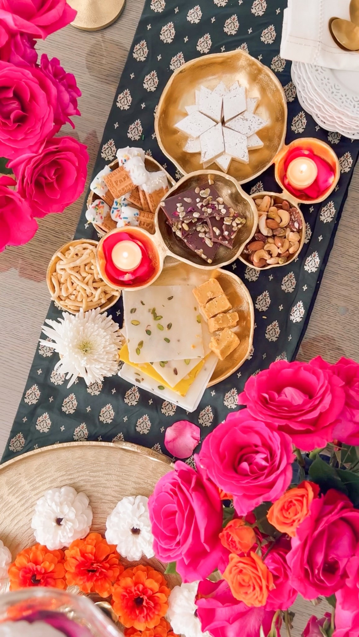 ✨ Festive Season: Diwali Hosting Made Easy (and Beautiful!) ✨

Who says you need fancy serveware to impress? Your mithai, cookies, and festive treats deserve to shine and with a little creativity, they absolutely will.

Think: simple setups, pretty plating, and small touches that look luxe (without the stress). Use what you have, play with textures, and make it fun. Use a cutting board, cake stand, inverted cups or trays, or even a thali. 

💡 Hosting tip: Mix sweets + savoury + dry fruits for a more interesting spread and don’t forget a pop of color with florals or garnish!

❤️ Follow for more easy festive hosting ideas - let’s make Diwali magical!

#LTKSeasonal #LTKHome #LTKParties