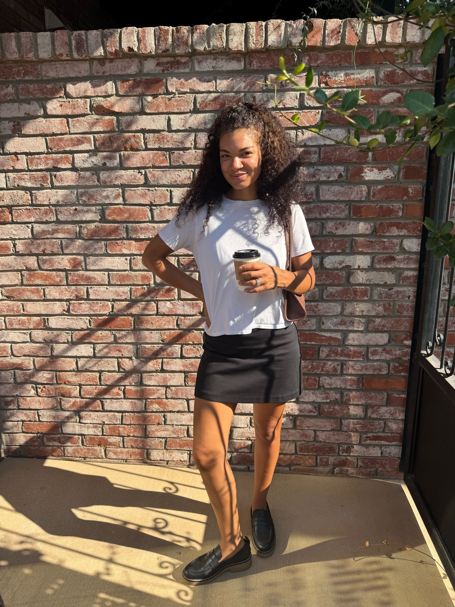 Early fall outfit: white t shirt, black skirt, lug sole loafers, chocolate brown bag

#LTKootd