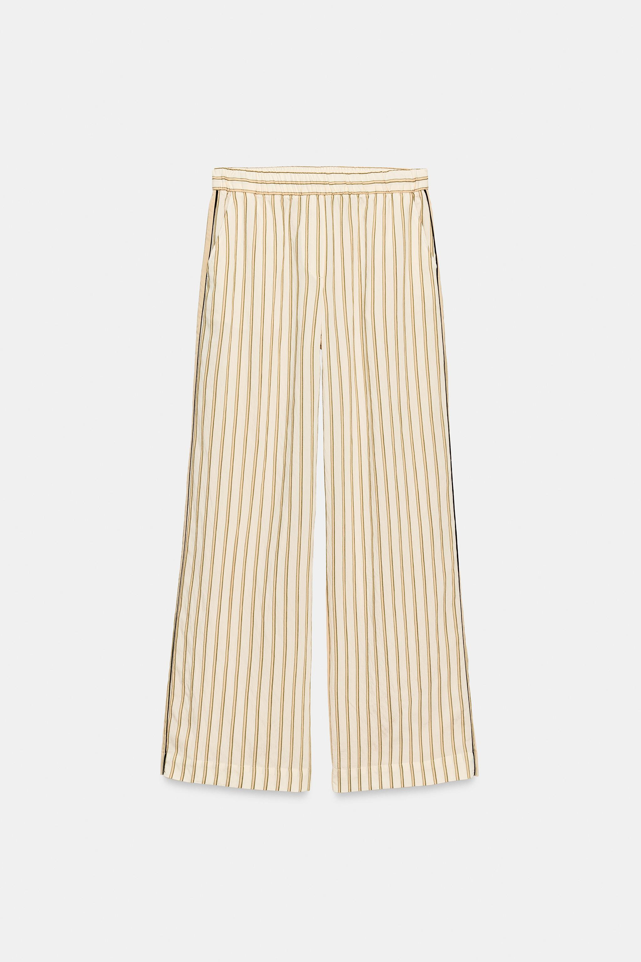 ZARA WOMAN COLLECTION. Trousers made from a viscose blend. Mid-rise with an elastic waistband. Hi... | Zara US