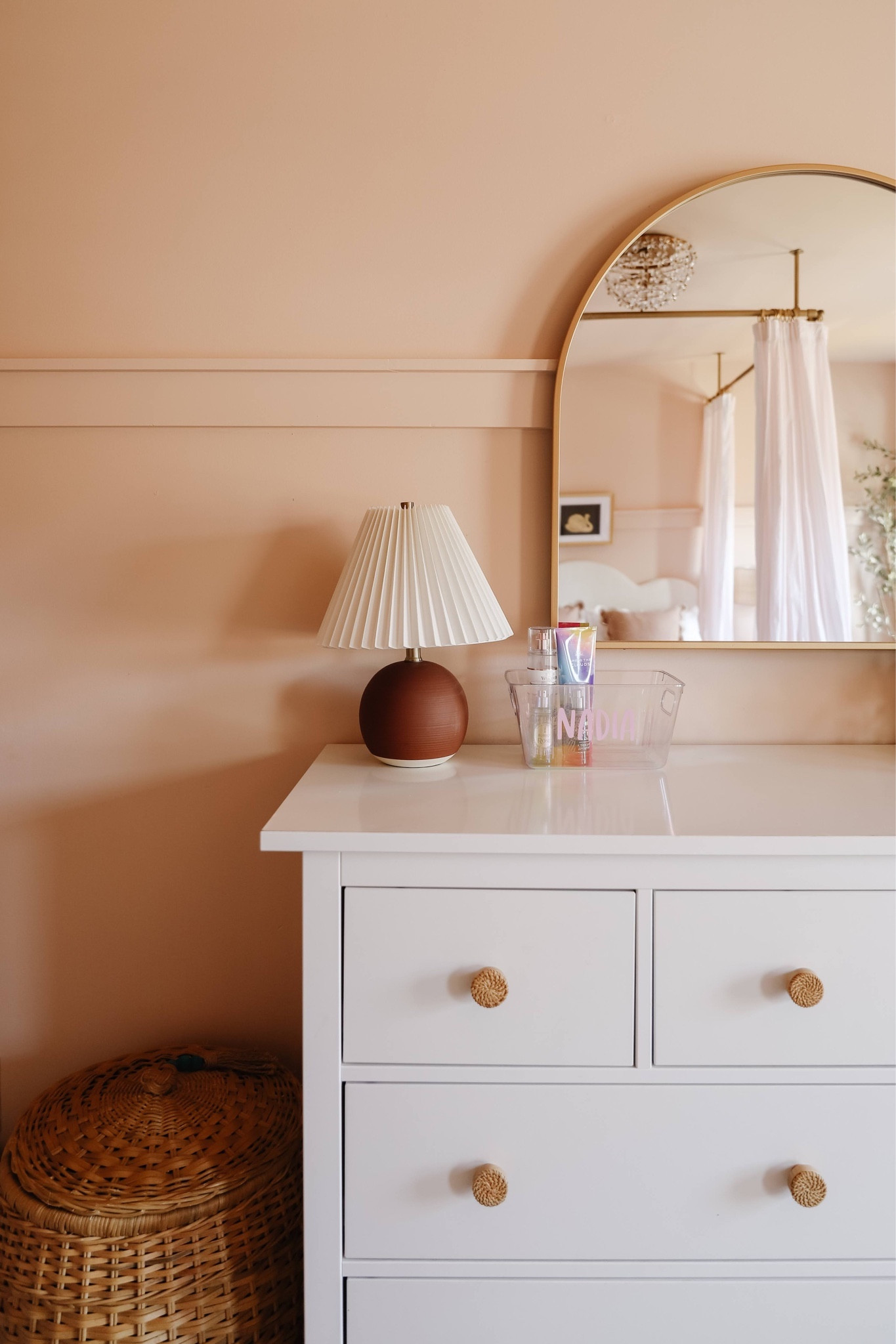 Dresser, rattan knobs, large basket, basket hamper, burgundy lamp with pleated shade, arch mirror, kid room, girl room, teen room 

#LTKhome #LTKkids #LTKfamily