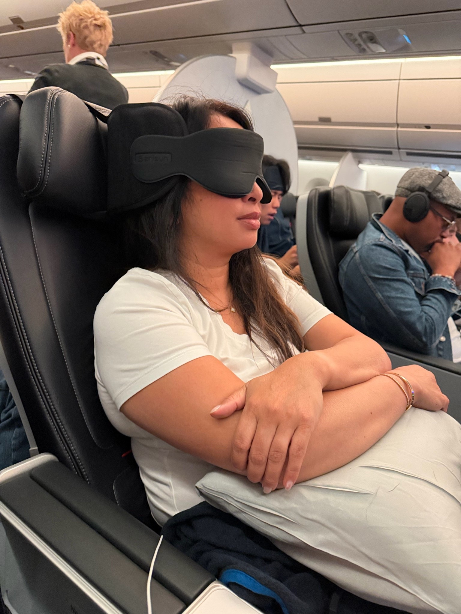 Best travel pillow. Back snaps onto headrest and front eye mask Velcro to back to hold your head up. Mask is very dark and this is comfortable and saves your neck!