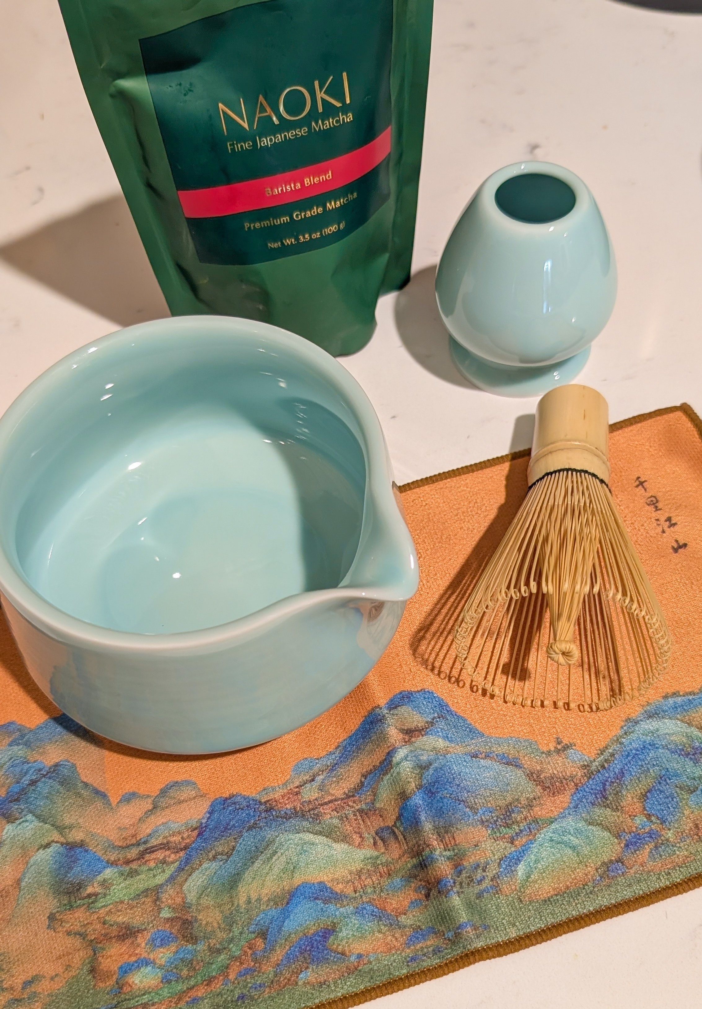 Light blue ceramic matcha making set. Includes a bowl with spout, bamboo matcha whisk, whisk holder, two matcha scoops and a microfiber towel. Naoki barista blend matcha is perfect for everyday lattes.

#LTKHome #LTKFindsUnder50 #LTKTravel