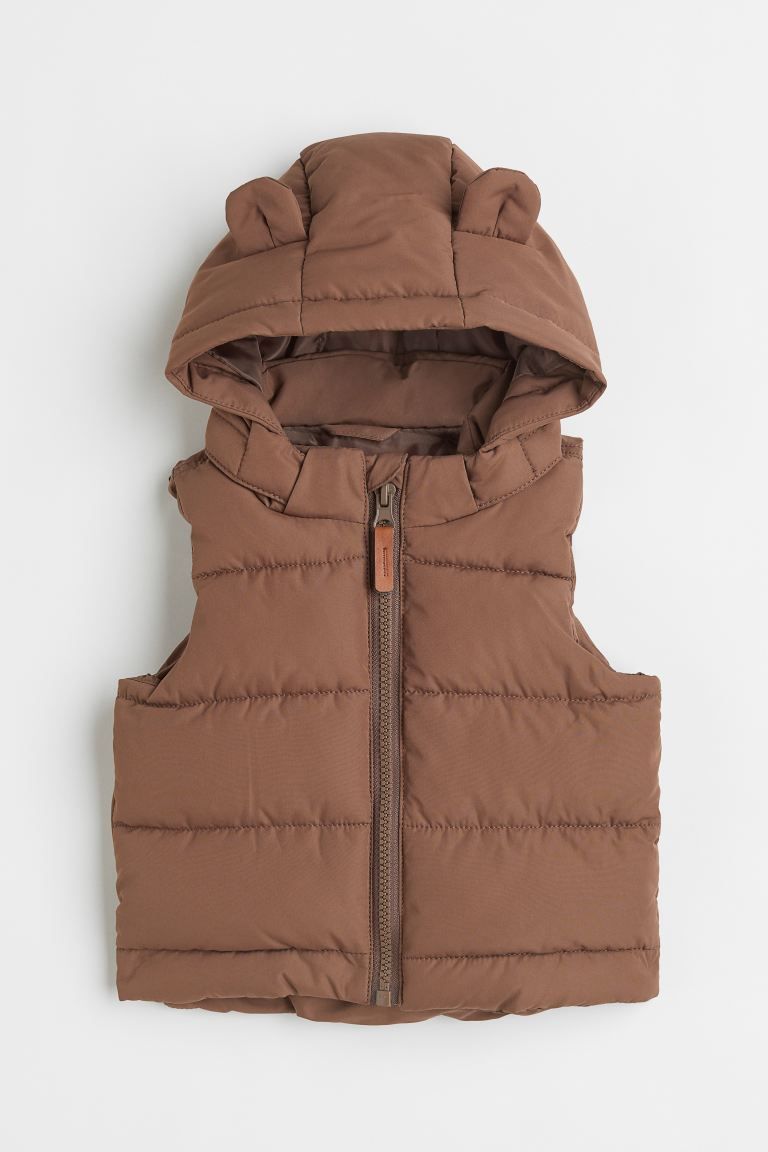 Conscious choice  New ArrivalPadded vest in woven fabric with a detachable hood. Zipper at front ... | H&M (US + CA)