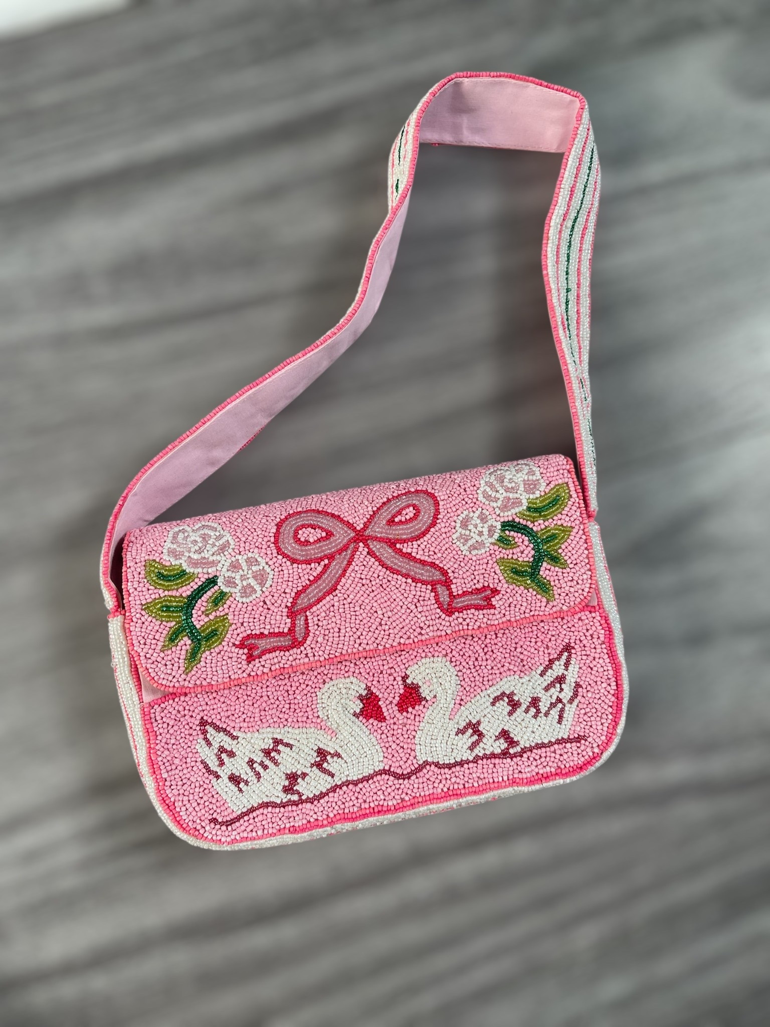 Pink Swan Beaded Shoulder Bag 💕🦢

Such a charming statement bag for the holiday season and beyond ✨ This pink beaded shoulder bag features the sweetest swan design with delicate florals and bow detailing, making it feel extra special and feminine. It’s the perfect accessory to elevate festive outfits, Valentine’s Day looks, or even everyday dresses when you want something playful but polished 🎀💗 Lightweight, fully beaded, and easy to carry, this is one of those standout accessories that instantly pulls an outfit together and also makes a great gift idea for anyone who loves whimsical details and classic style.

Pink beaded bag, swan beaded purse, beaded shoulder bag, holiday accessories women, Valentine’s Day outfit accessories, feminine handbags, statement purse, pink handbag outfit, gift idea for her, boutique handbags, holiday party accessories, cute beaded purse, spring accessories women

#LTKGiftGuide #LTKHoliday #LTKFindsUnder50