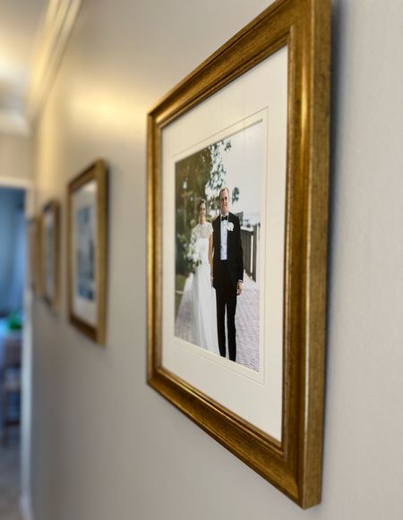 Wedding photos are in so getting a few printed and hung before guests arrive for Thanksgiving quickly went to the top of my to-do list! I love the finish on these Amazon frames that come as a four pack. I upgraded the mat to ones with a bevel cut v detail to make them seem a little more professionally done. Frames are forty dollars for four frames (I have color: gold)! Mats come as a pack of ten for twelve dollars (I have color: ivory)!

Gold frames, Amazon picture frames, ivory mats, picture frame mats, affordable framing, wedding photos, wall decor 

#LTKfindsunder50 #LTKhome