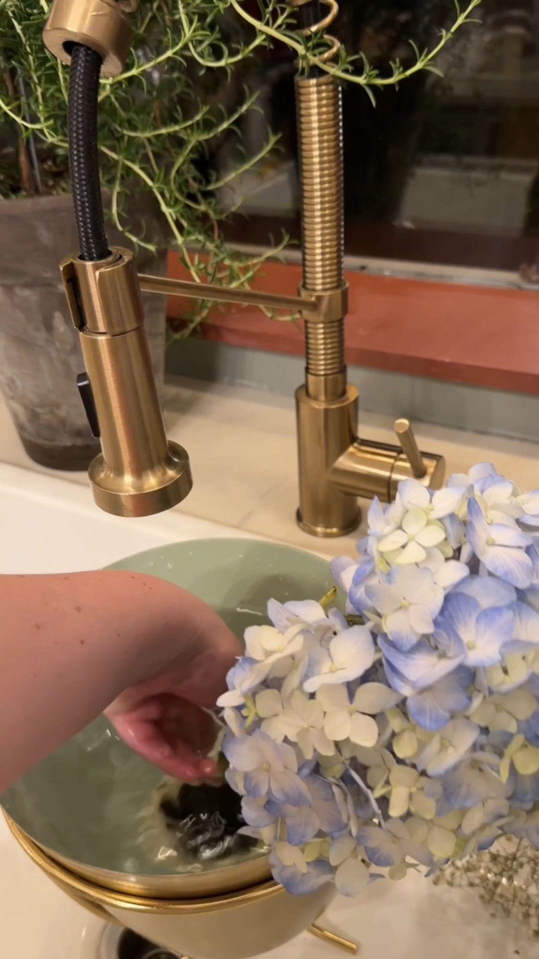 Arranging cut flowers! Every home needs a flower frog. It makes arranging flowers easier! 

#LTKSeasonal #LTKHome