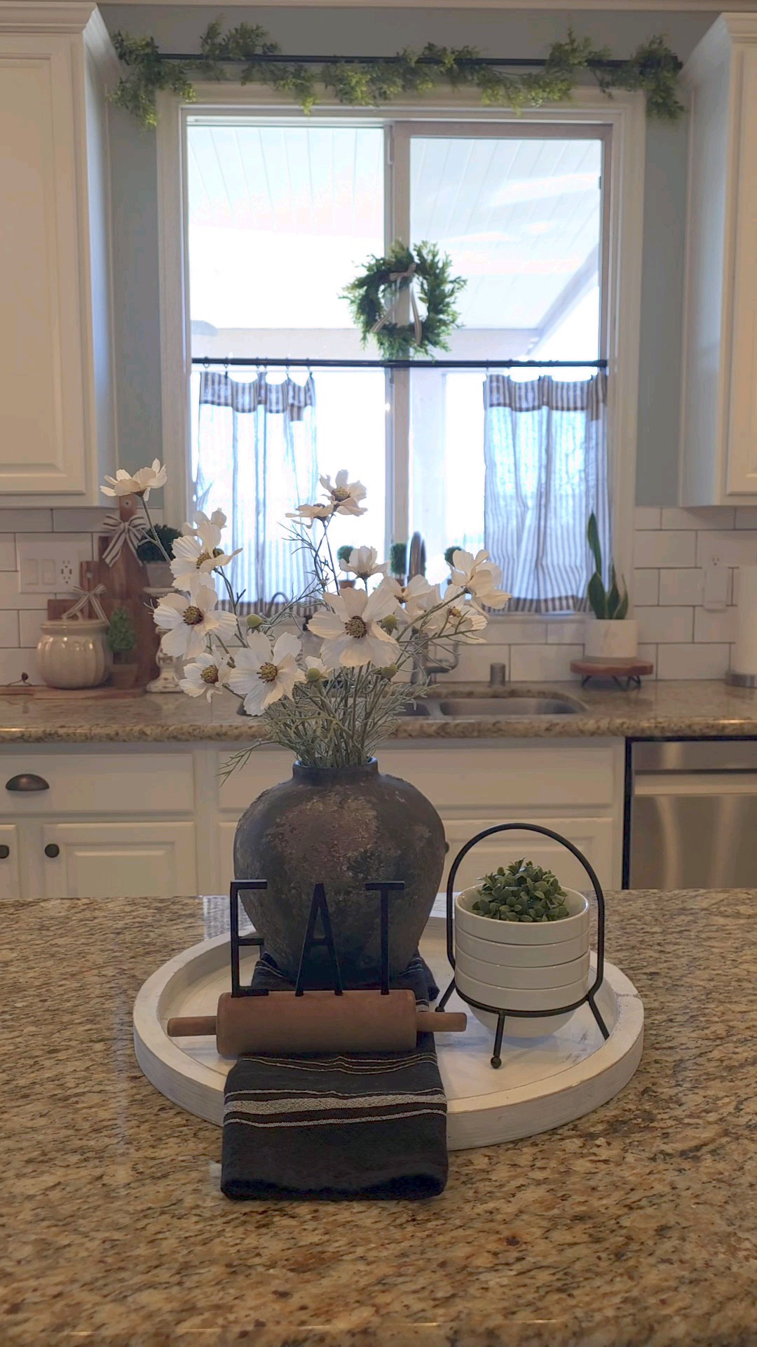 Kitchen window decor.Kitchen/Cafe curtains/ Ticking stripe/ Topiary/Topiaries/ Plants/Kitchen decor/Kitchen plant/Garland/Home decor/

#LTKHome #LTKSeasonal #LTKStyleTip