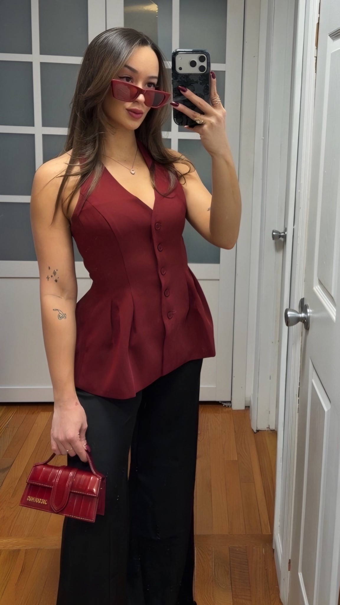 Obsessed is an understatement ❤️ This burgundy halter vest top is from Tobi (so I couldn’t link it here 😭) but it’s such a flattering, structured fit & gives the perfect chic date night / boss babe energy. Paired with wide leg satin black trousers for that sleek, elevated silhouette.

I linked my red mini bag & sunglasses because they complete the whole vibe — I love how everything ties together in this deep red tone.

This outfit is giving:
✨ Date night outfit
✨ Girls night look
✨ Valentine’s outfit inspo
✨ Chic winter outfit
✨ Elevated going-out style

Everything I could link is right here 🖤

#LTKootd #LTKWorkwear #LTKNYFW