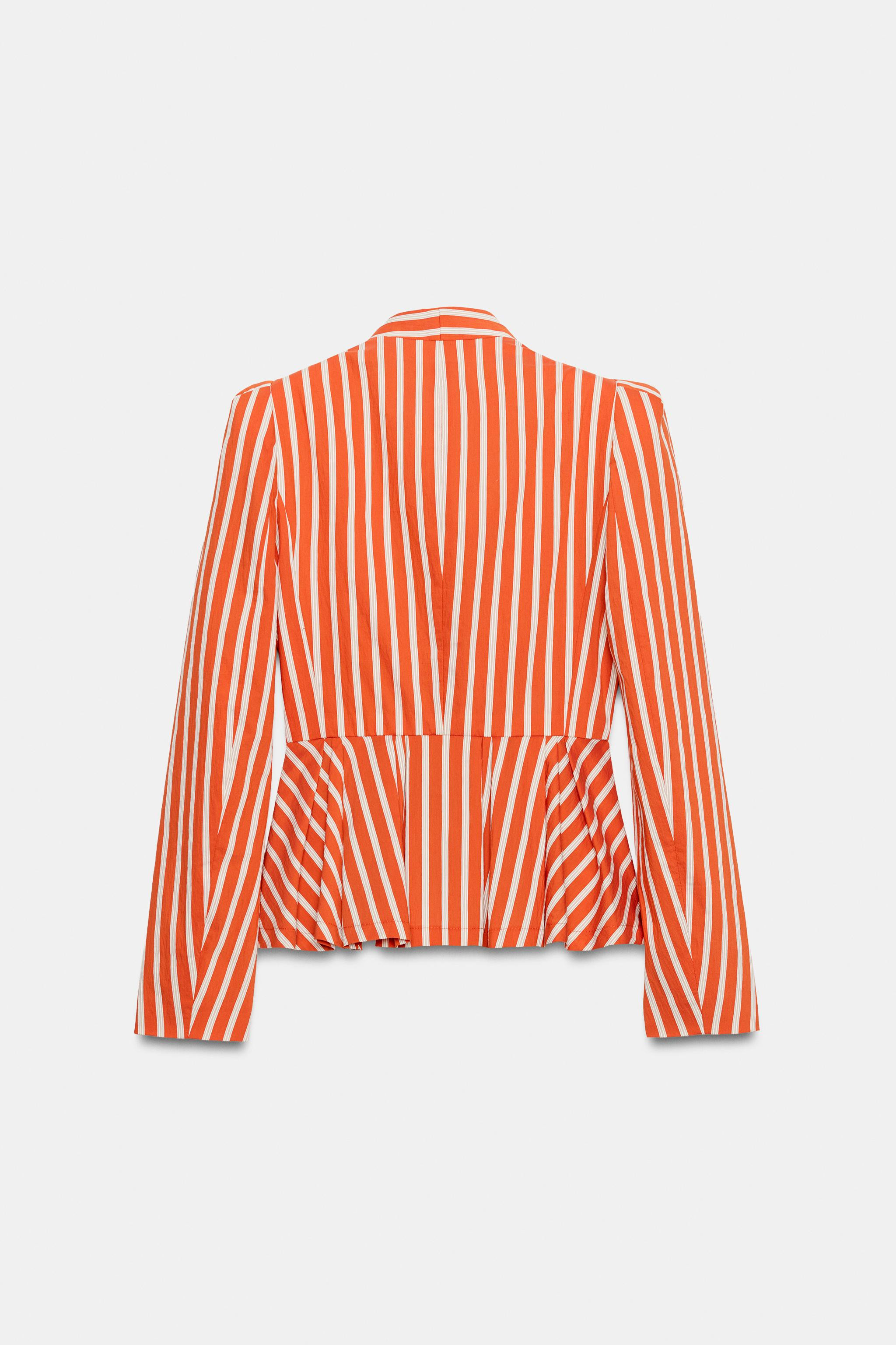 Collarless blazer with long sleeves and shoulder pads. Flared hem with pleats. Front button closu... | Zara US