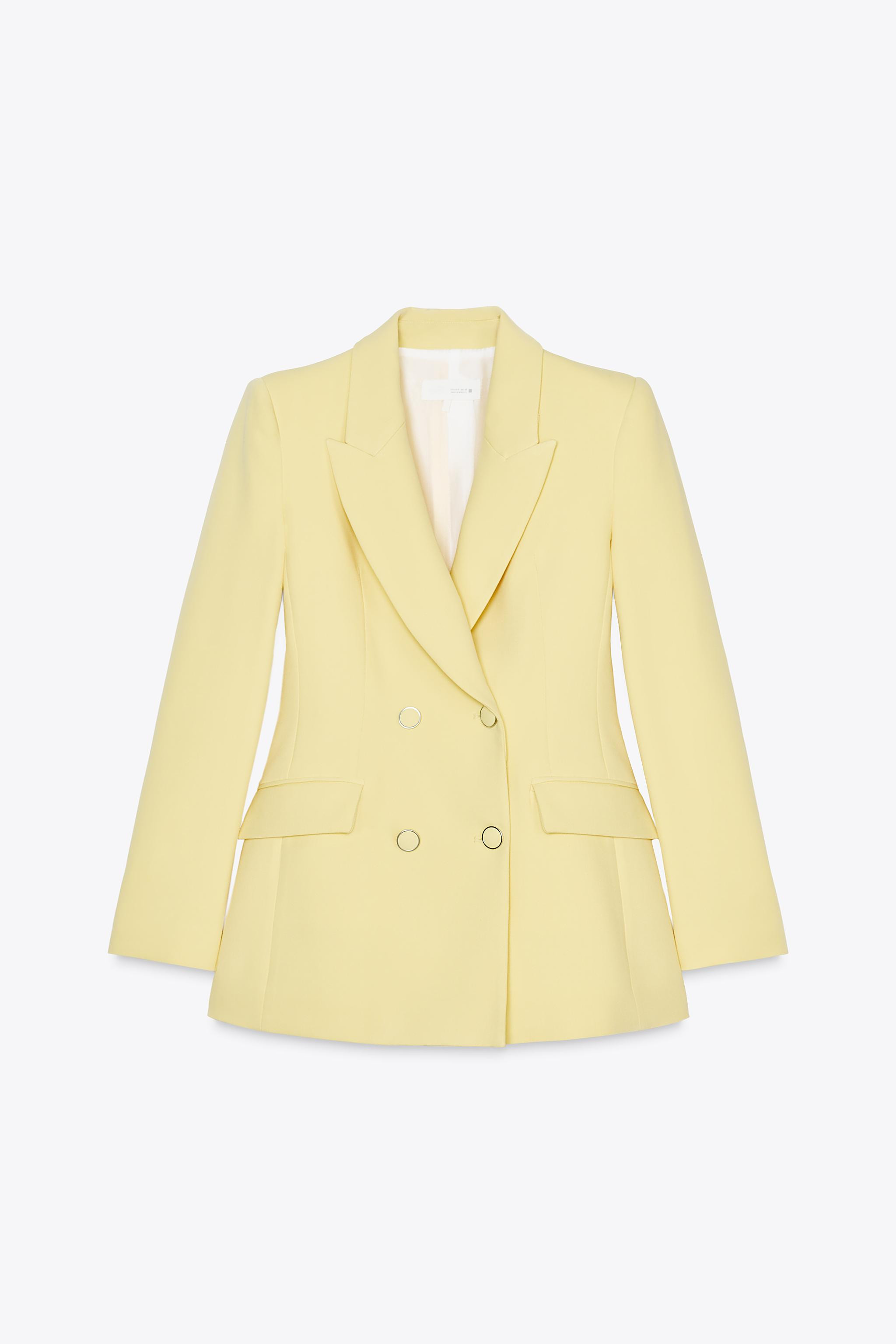 Jacket with lapel collar and long sleeves with shoulder pads. Front flap pockets. Double breasted... | Zara US