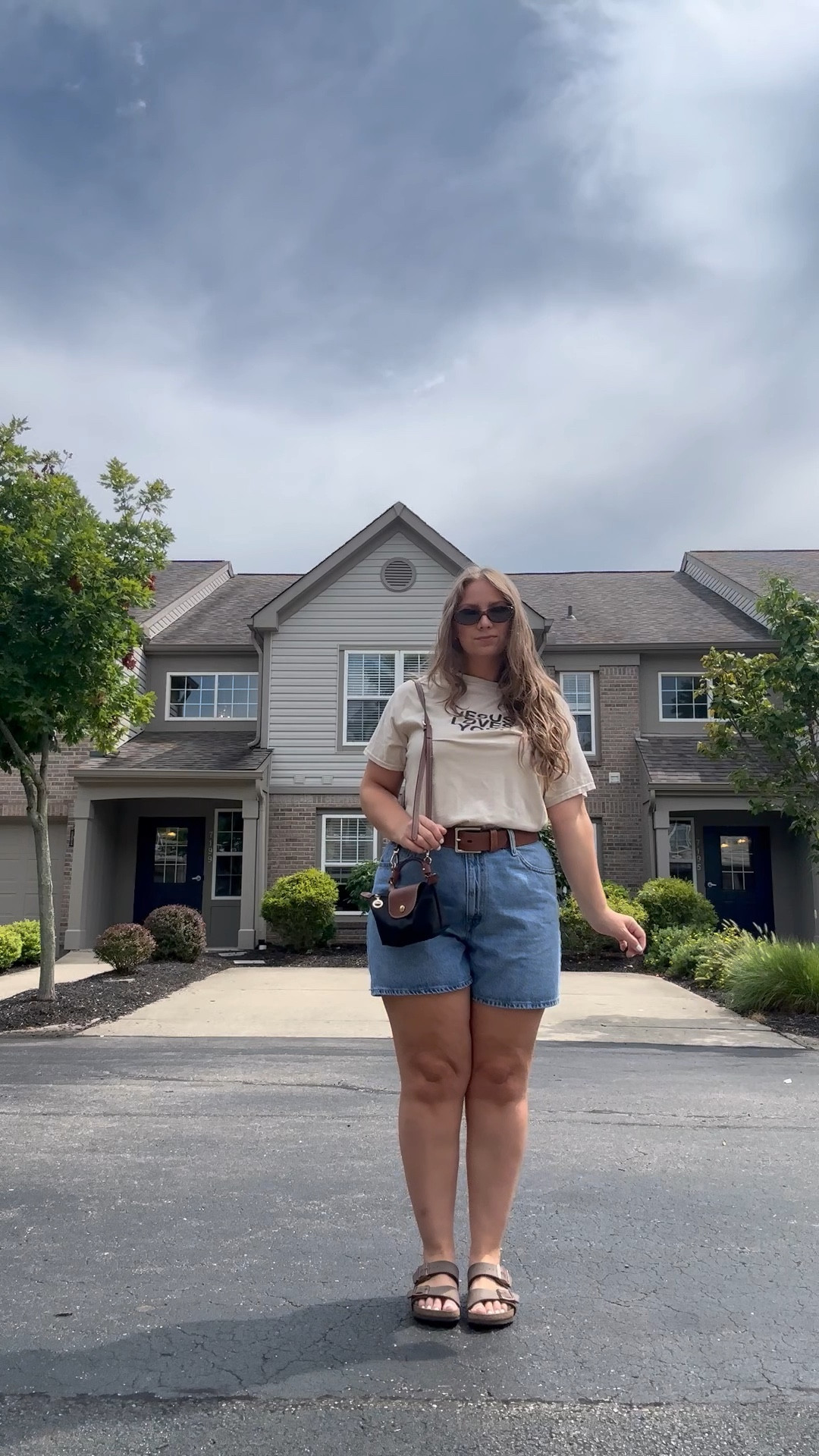 Shirt can’t be linked but it’s from Jesus Loves You Company 🤍

Best denim shorts ever — have an adjustable waist and hit mid thigh. Wearing a size 32!

Longchamp bag looks so cute dressed down too and actually holds more than my normal crossbody!

#LTKStyleTip #LTKFindsUnder50 #LTKItBag