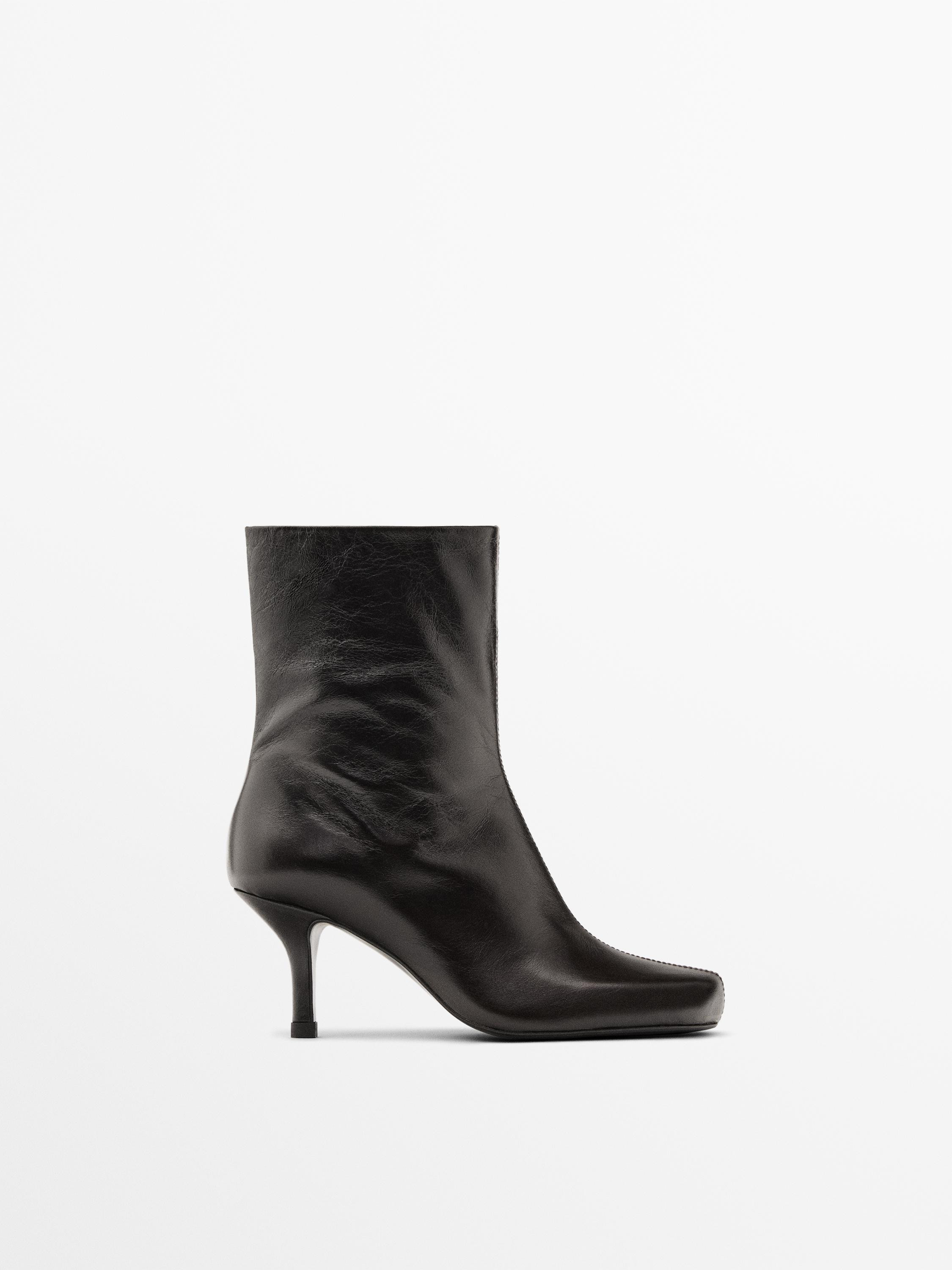 Made of cowhide leather. Round toe. Leather lining and insole . Wrinkled faux leather. Side zip f... | Massimo Dutti UK