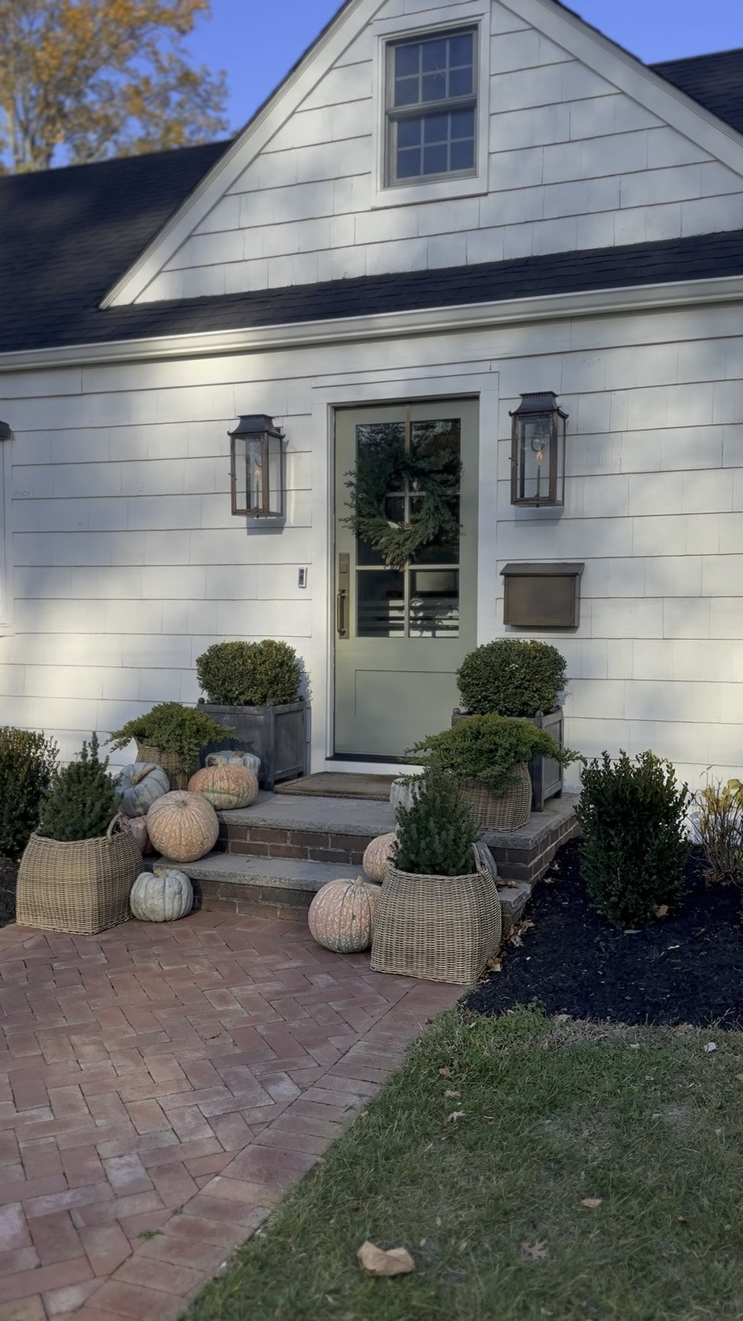 front door decor for the fall #designbykaratheresa

front door, gas lanterns, welcome door mat, brass wall mounted mail box, wicker planter basket, boxwoods, holiday wreath , thanksgiving decor 

#LTKHome #LTKSeasonal #LTKHoliday