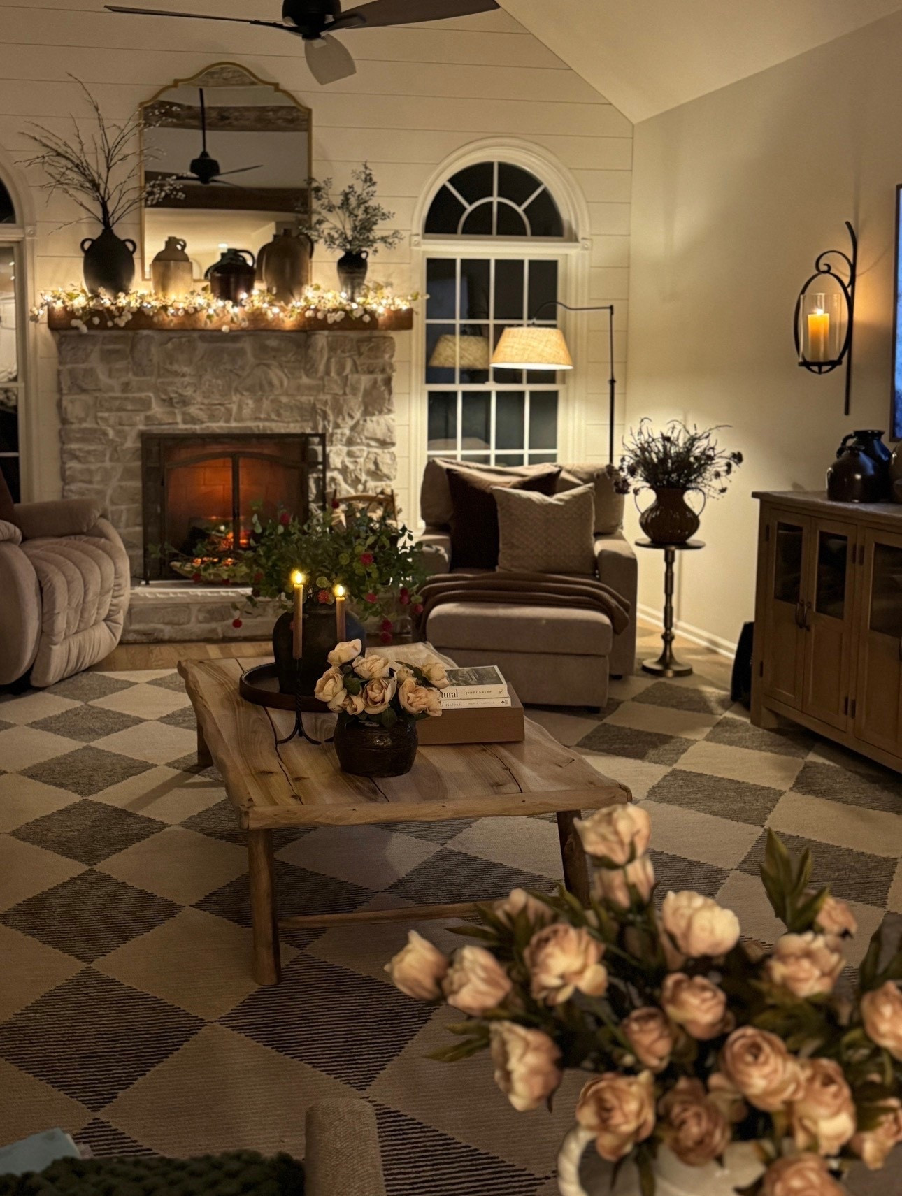 Family room styling 

Faux florals and stems
Accent table
Area rug
Fireplace mirror
Floral throw
Candlesticks
Battery operated candles 
Coffee table & books
Solid wood buffet table
Electric fireplace insert 
Throw pillows 

#LTKHome