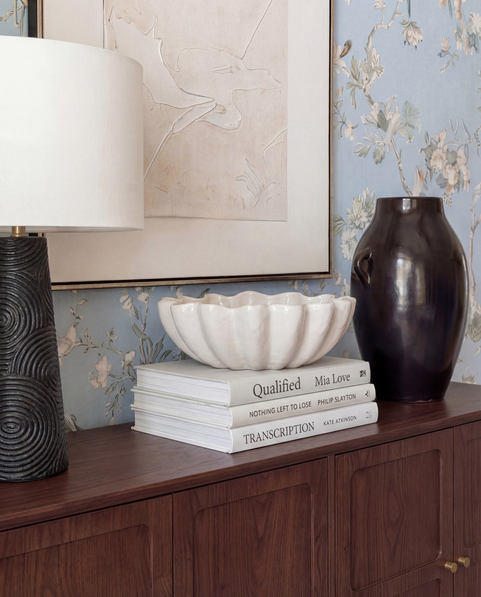 Shop the Look:
• Solid wood dining table
• Upholstered dining chairs with brass frames
• Blue floral wallpaper
• Blue patterned traditional rug
• Wood ceiling beams
• Glass candle holders
• Black ceramic bowl decor
Black ceramic vase
Brass serving tray
Solid wood buffet console
Solid oak tall cabinet
Black ceramic decor bowl
White decor books
Black table lamp, white fluted decor bowl
• Neutral linen curtains
• Wood display cabinet with glass doors

#LTKSaleAlert #LTKHome #LTKFindsUnder100