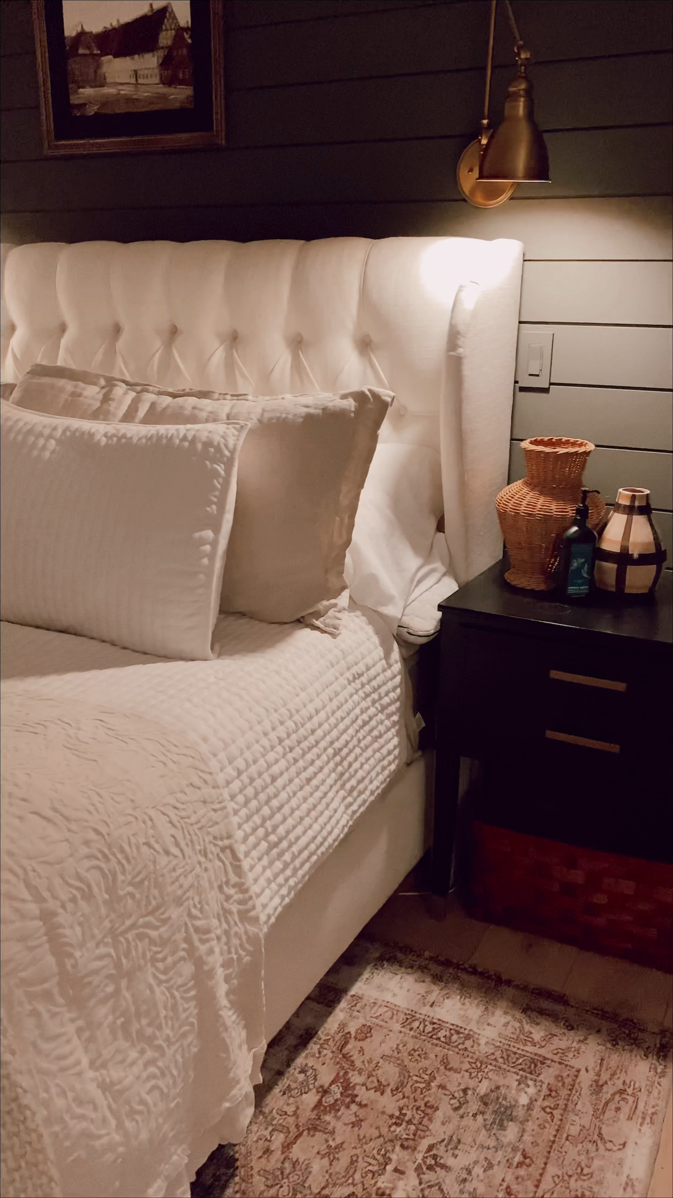 Evening bedroom view | tufted linen headboard, black nightstand, velvet quilt, linen duvet, brass swing arm wall sconces, woven wood baskets, woven ottoman, pinch pleat linen curtains

#LTKSeasonal #LTKFind #LTKhome