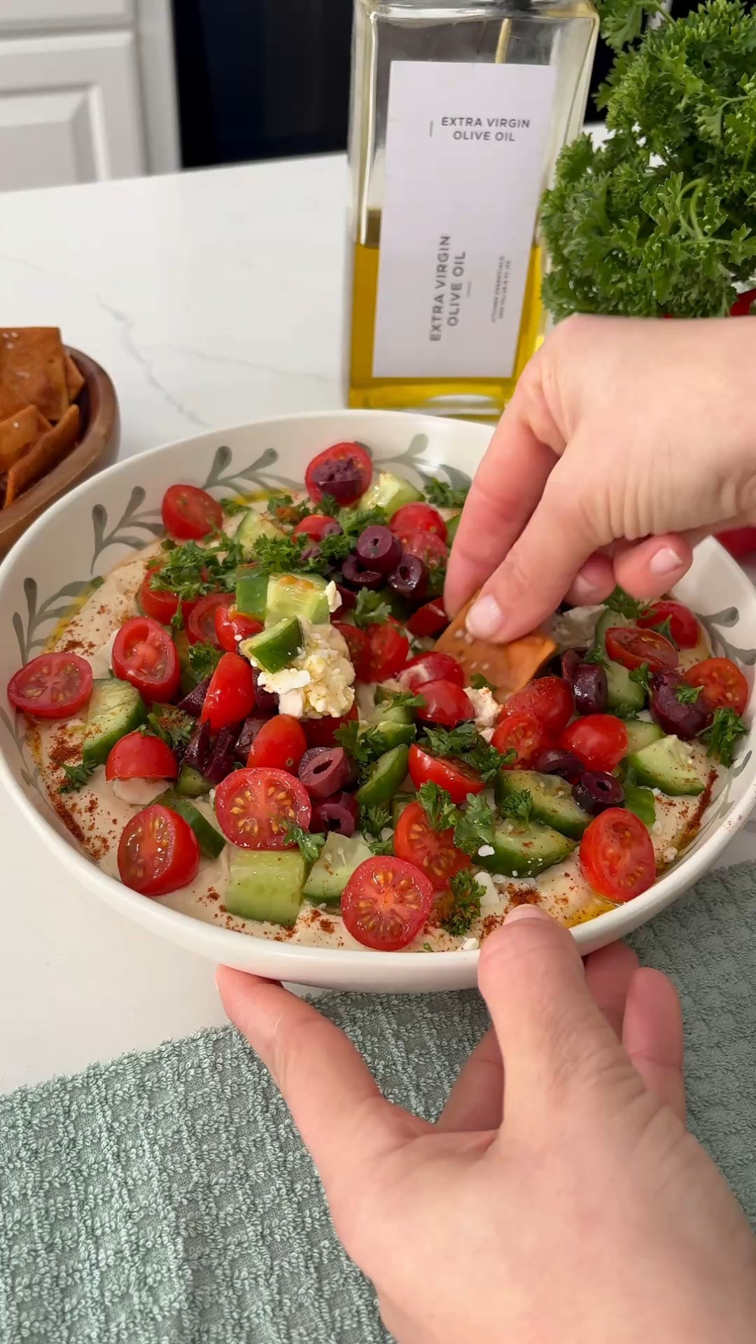 7 layer hummus dip appetizer so easy and definitely a crowd pleaser 
It looks even better in this decorative bowl 
Ingredients 
-Hummus 
-Crumbled Feta 
-Chopped cucumber 
-Sliced tomatoes 
-Sliced black olives 
-Parsley
- Olive oil 


#LTKfoodie #LTKHome #LTKSeasonal