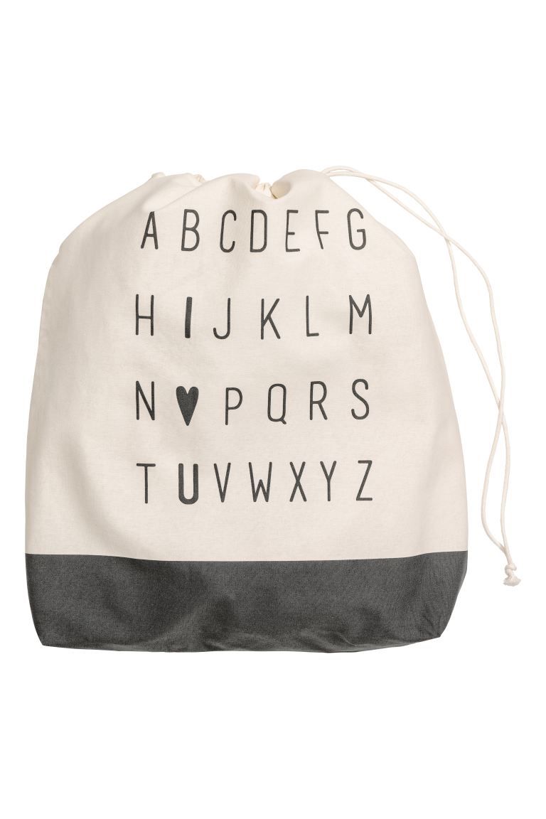 Large storage bag in woven cotton fabric with a printed design. Drawstring at top. Size 21 3/4 x ... | H&M (US + CA)