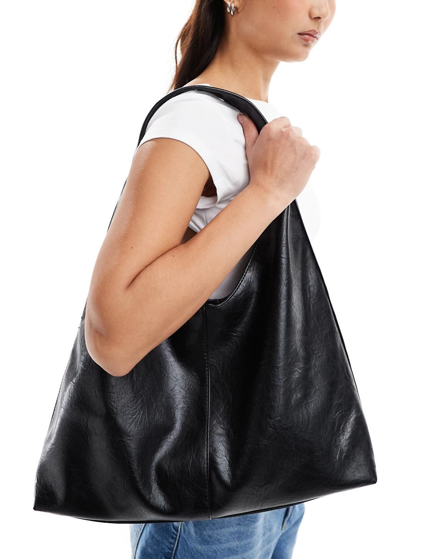 ASOS DESIGN large slouchy sling tote bag in black | ASOS (Global)
