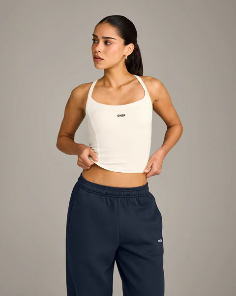 Mellow™ Rib Racer Back Mid Tank Top with Built in Bra Shelf 
 Off White | Oner Active (UK / US)