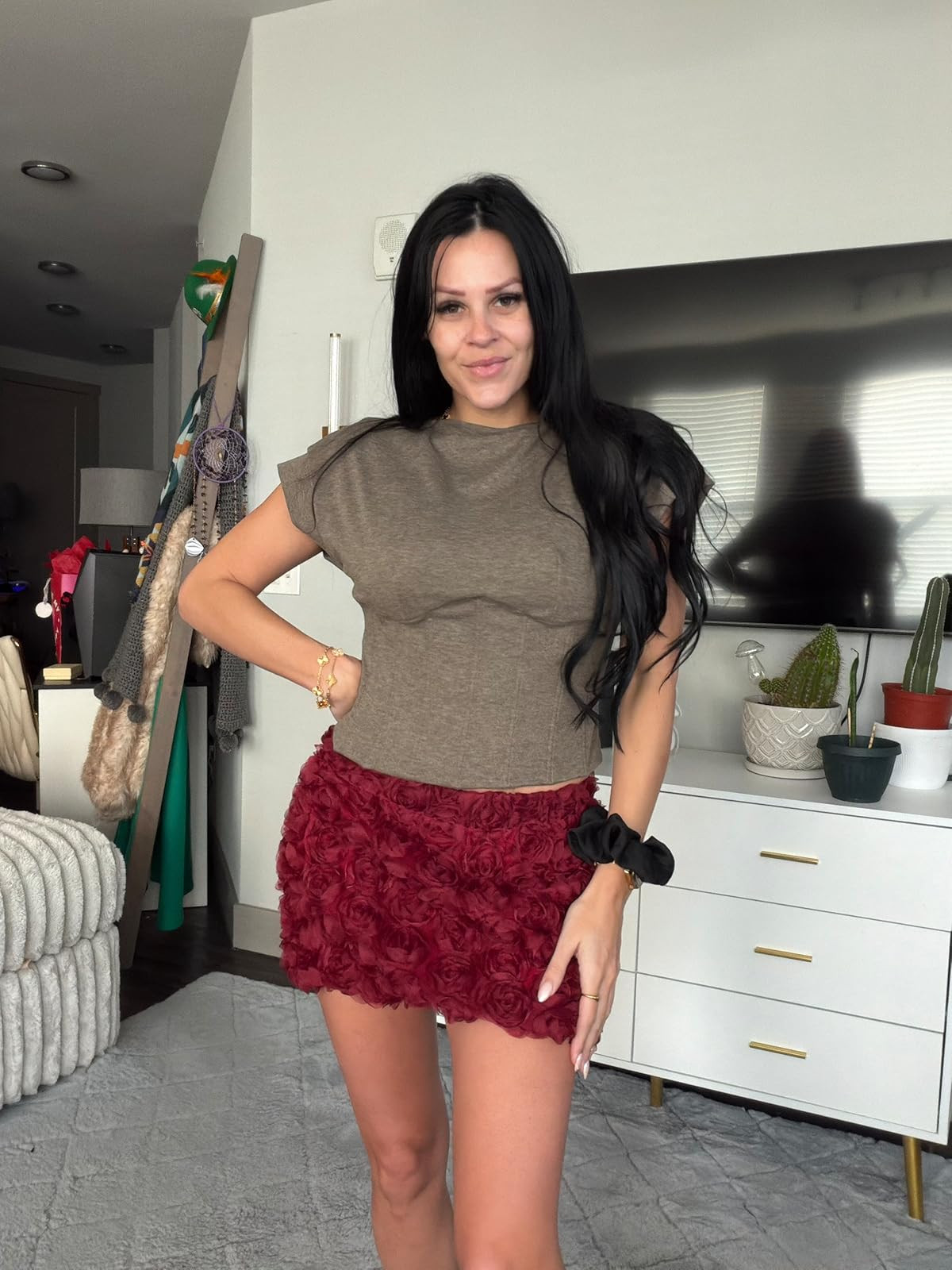 Textured and bold. This olive-toned cap-sleeve top paired with a 3D rosette textured mini skirt in deep burgundy is a major statement look for your next night out. #RosetteSkirt #NightOutStyle #LTKstyletip 

 #LTKSpringSale #LTKgrwm #LTKootd